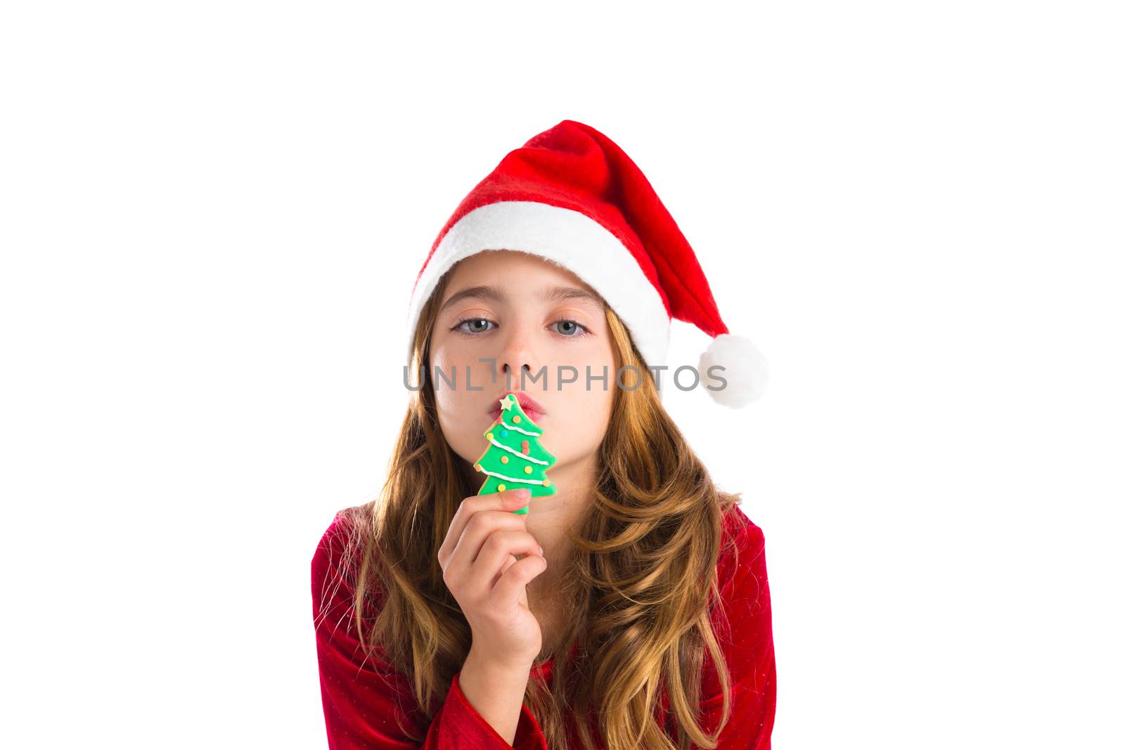 Christmas kid girl kissing Xmas tree cookie isolated on white background