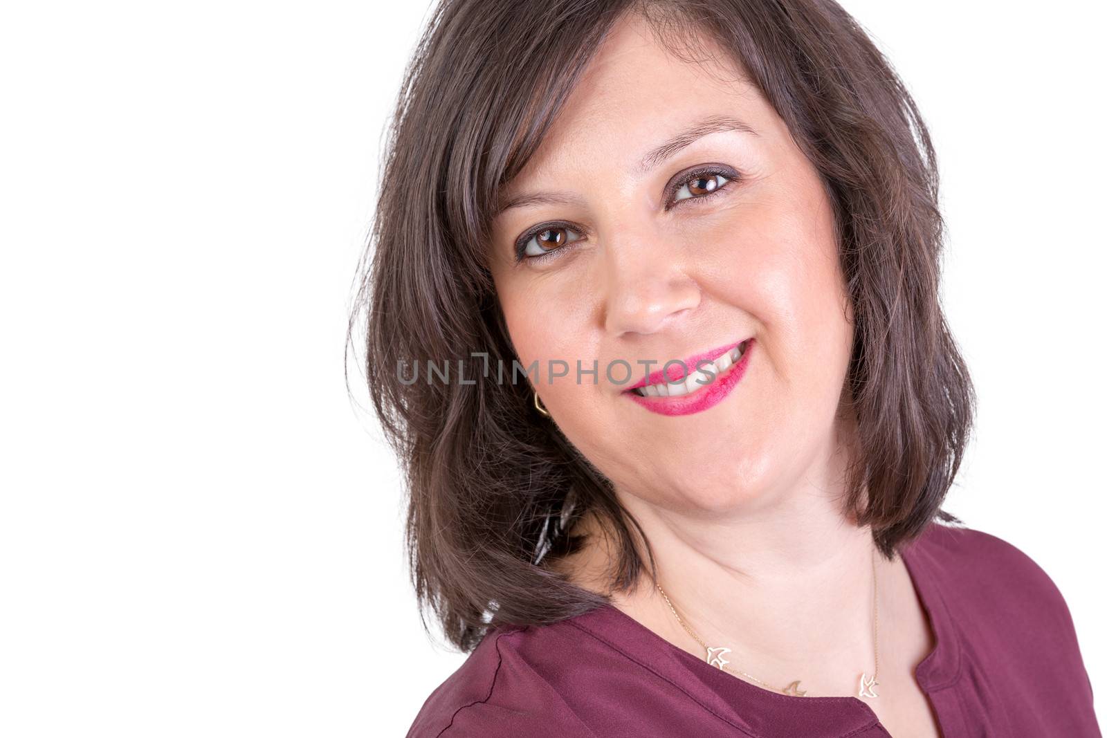 Dark Hair middle age woman looking in to your eyes naturally happy