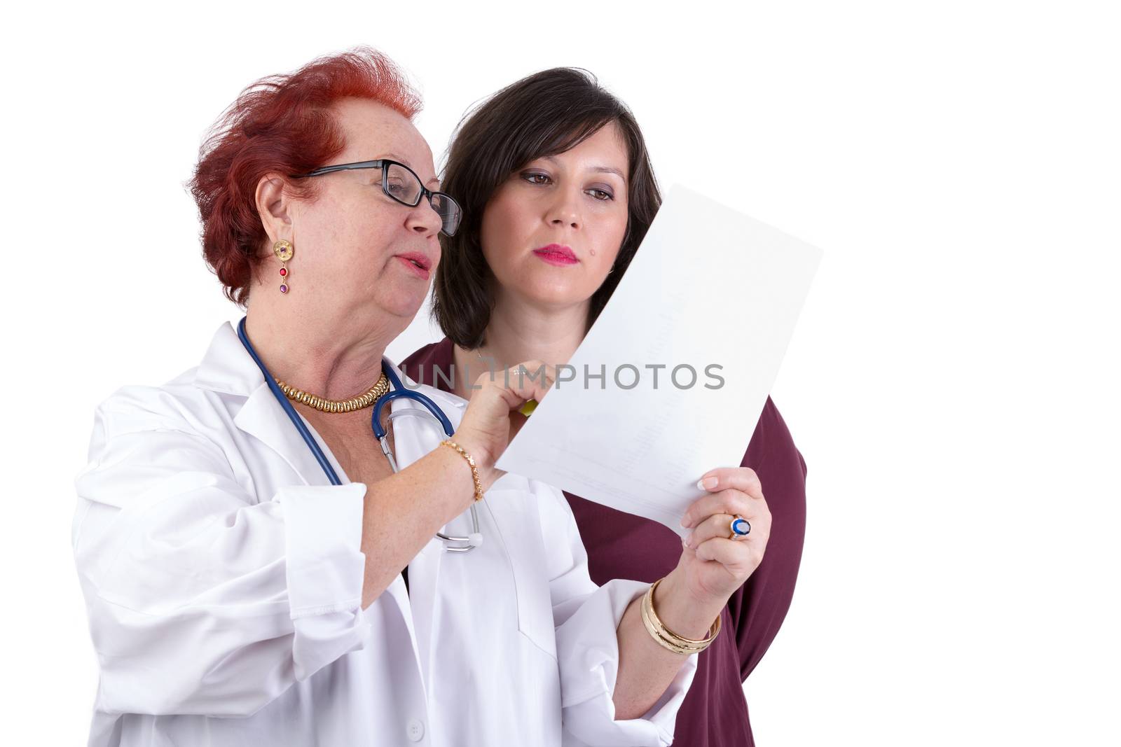 Female Doctor and her female patient discussing exam results, might be her blemish on her face