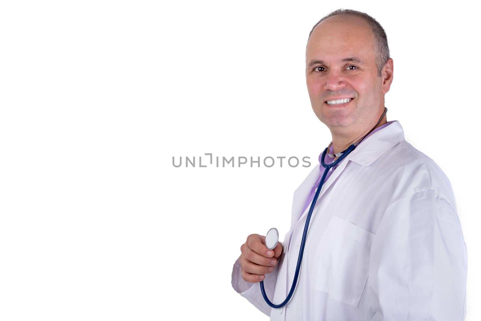 Middle age male practitioner doctor looking at you trustfully with a confident smile and holding his stethoscope