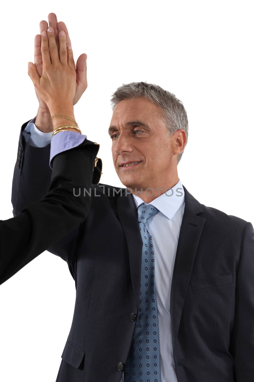 businessman and businesswoman touching hands