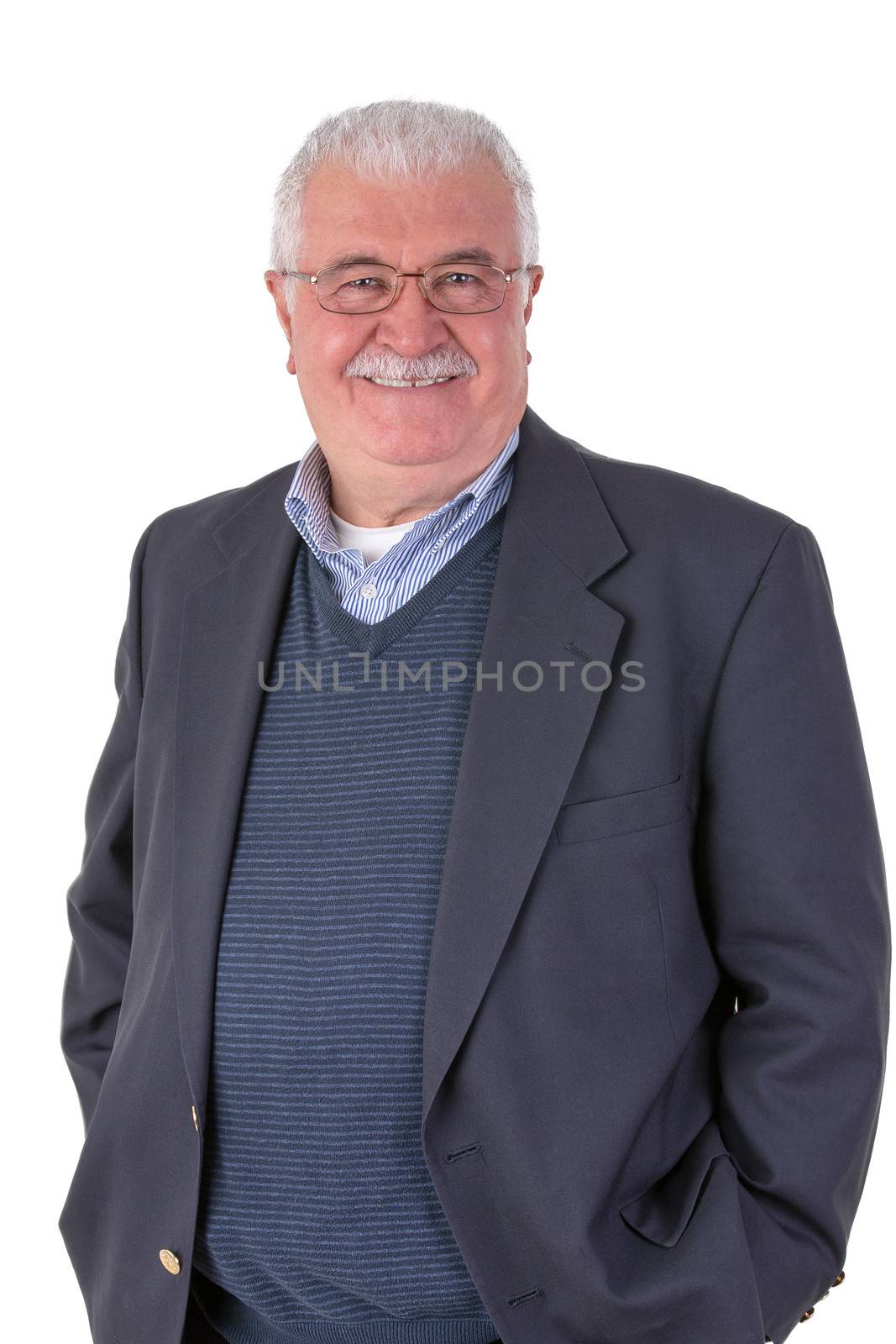 White hair senior adult with mustache looking at you smiling and satisfactorily with his glasses wearing dark blue suit