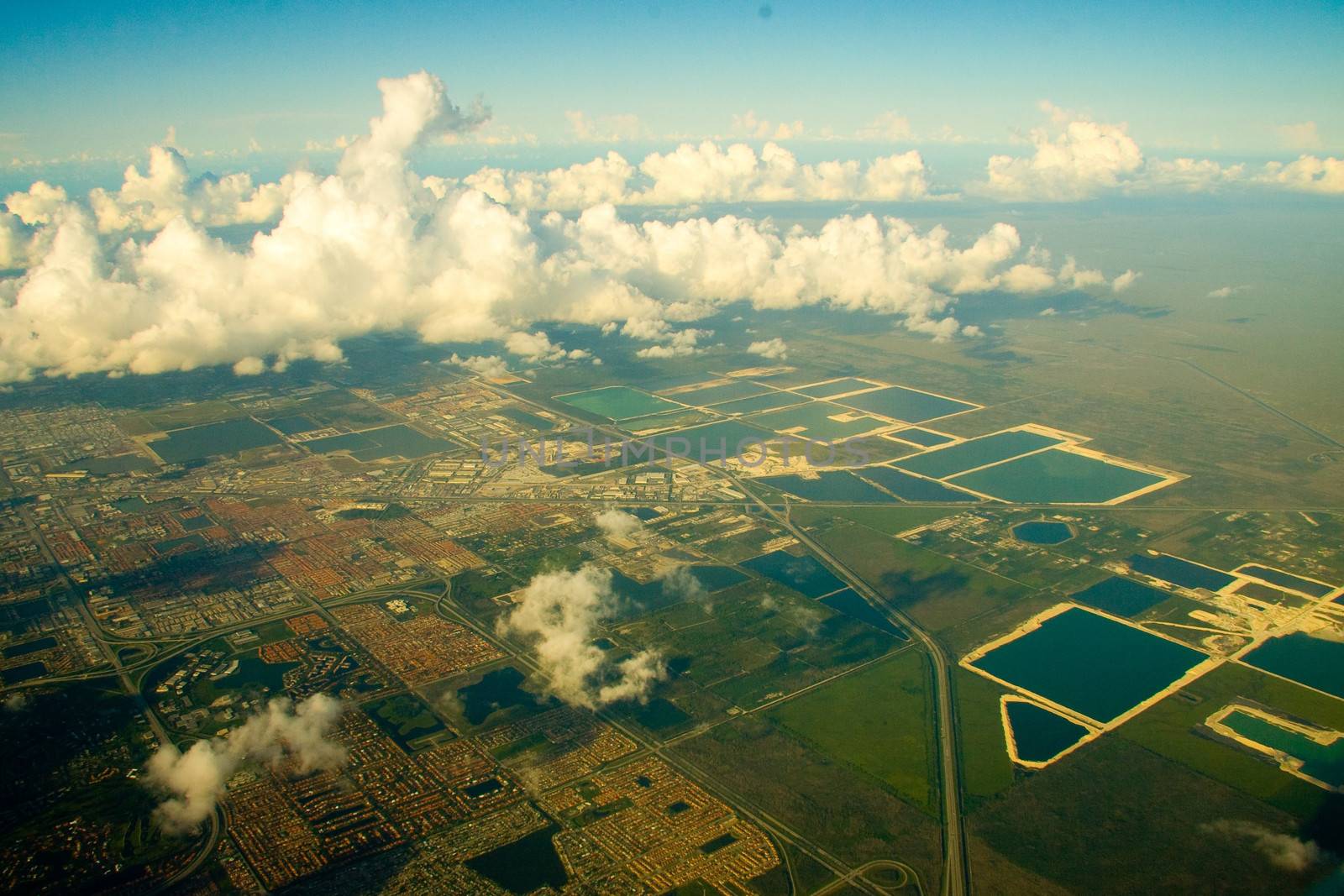 Aerial view of cloudscape over suburbs of Miami city, Florida, U.S.A.