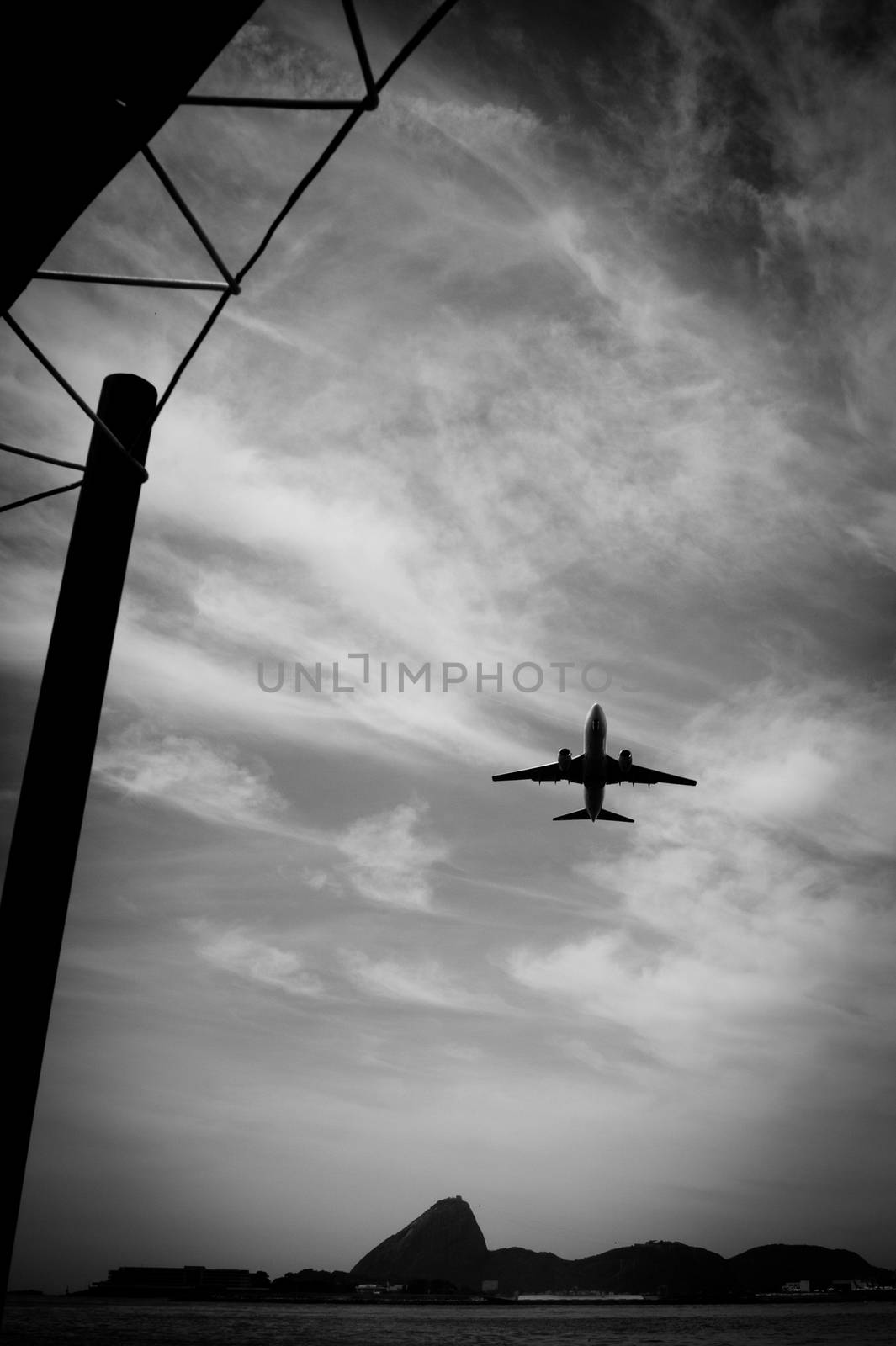 Airplane in flight over the city of Rio de Janeiro by CelsoDiniz