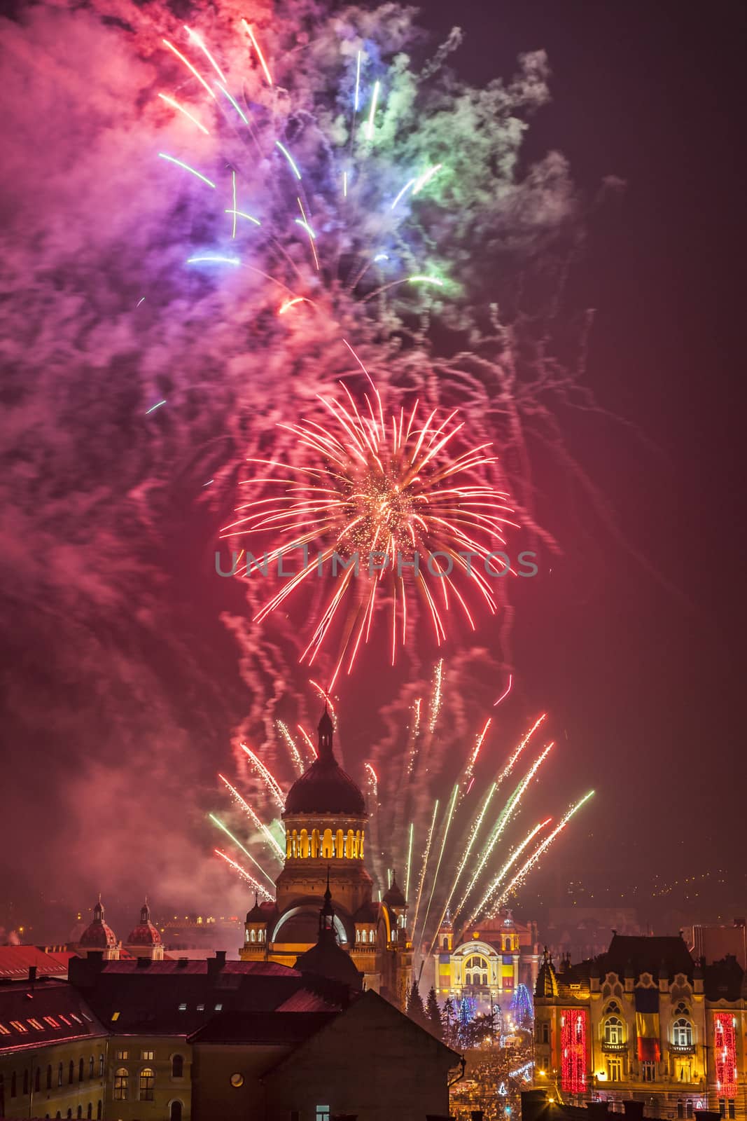  Beautiful fireworks show takes place in Avram Iancu Square in Cluj Napoca with the ocassion of The Romanian National day on 1 December 2013 in Cluj Napoca, Romania.