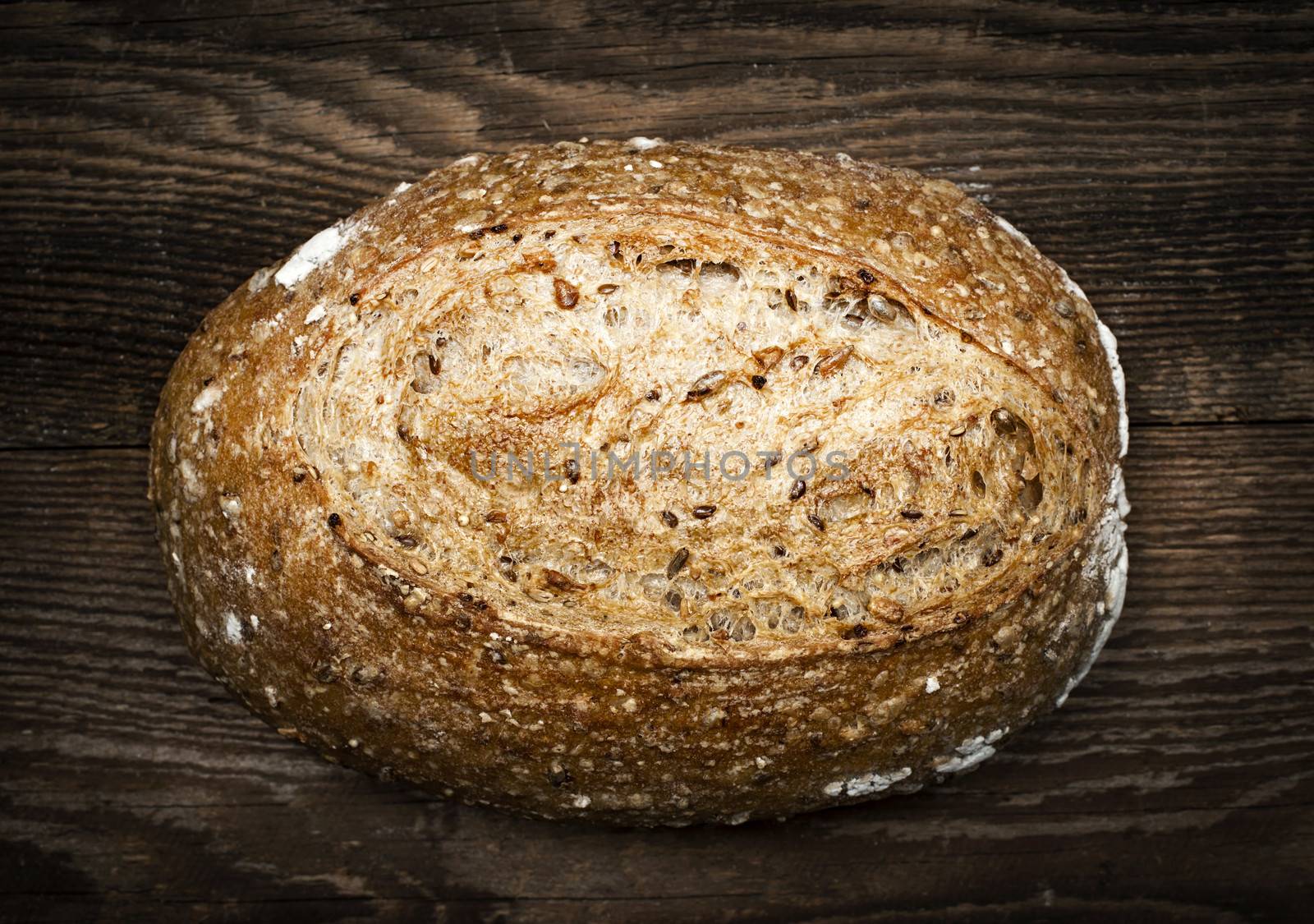 Loaf of multigrain artisan bread by elenathewise