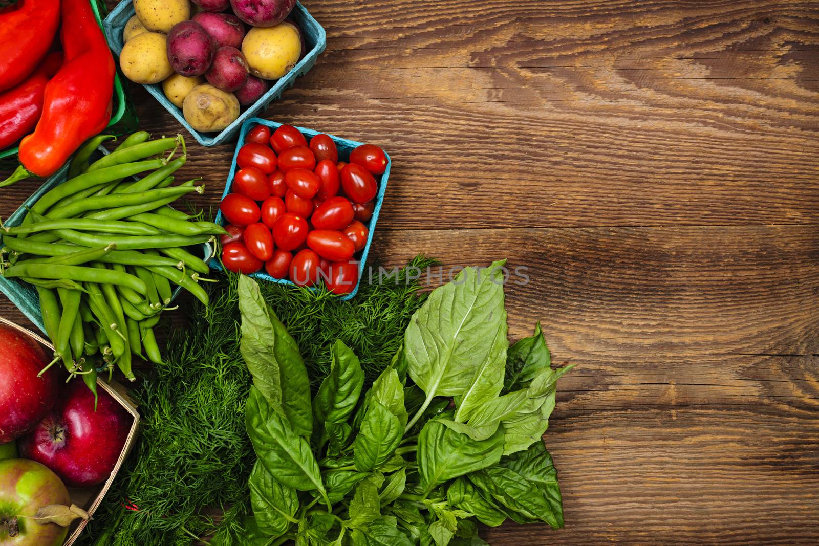 Fresh farmers market fruit and vegetable from above with copy space on brown wood