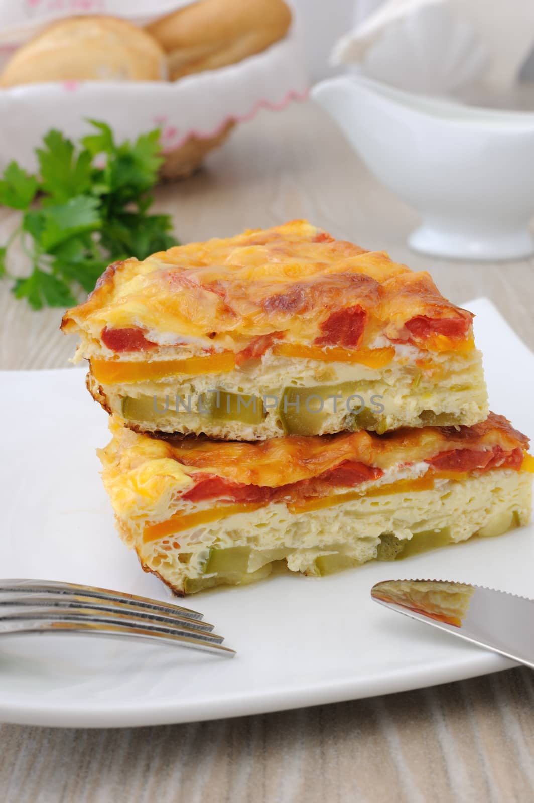 omelette slices of zucchini, carrot, tomato, with cheese