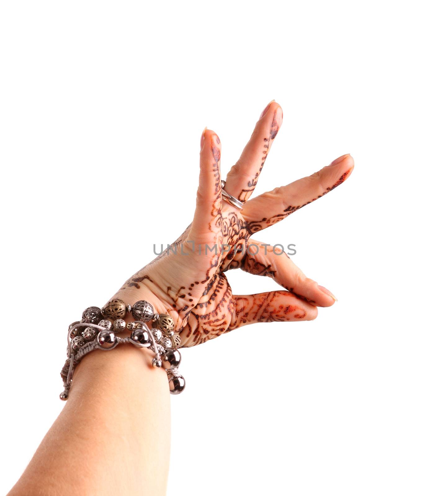 Female hand gesture of oriental dance. Female hand with henna painted on the white background
