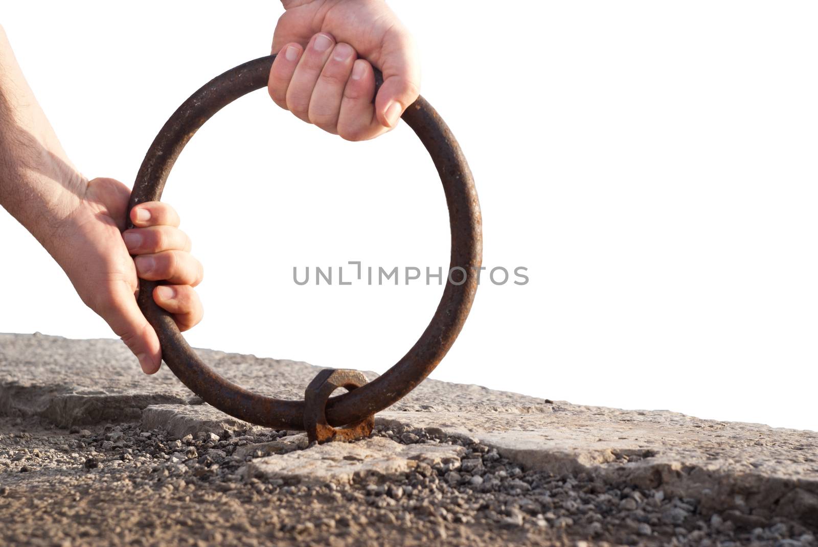 hands raise large old steel ring, isolated on white