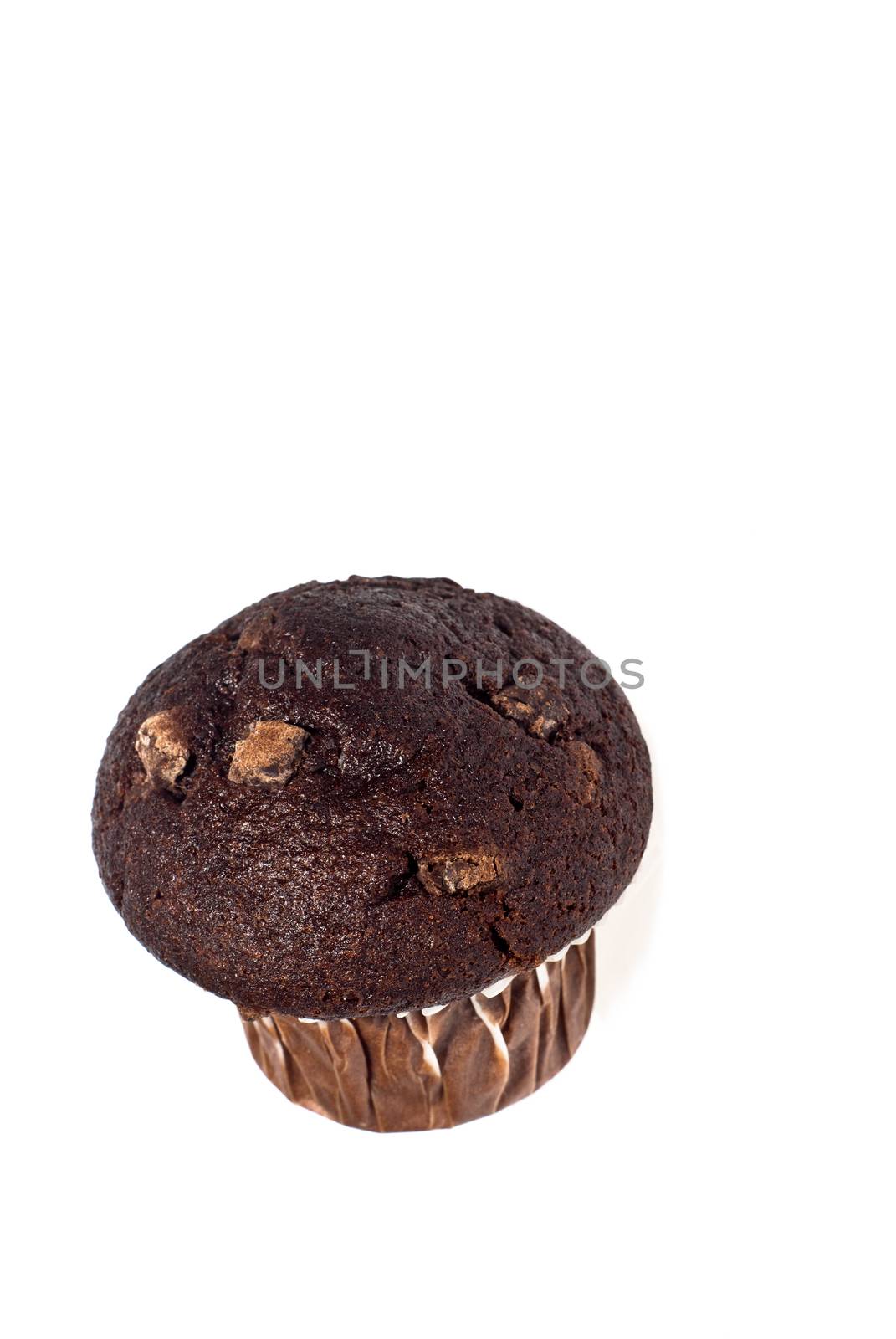 Close up of a fresh baked chocolate muffin against a white background