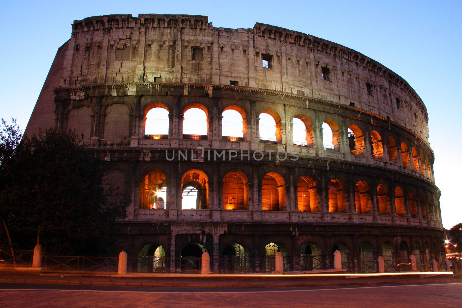 Exterior of Colosseum in Rome lighted during late afternoon, Italy.