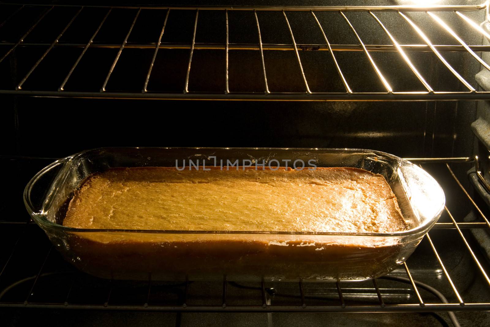 Closeup of corn cake baking in oven.