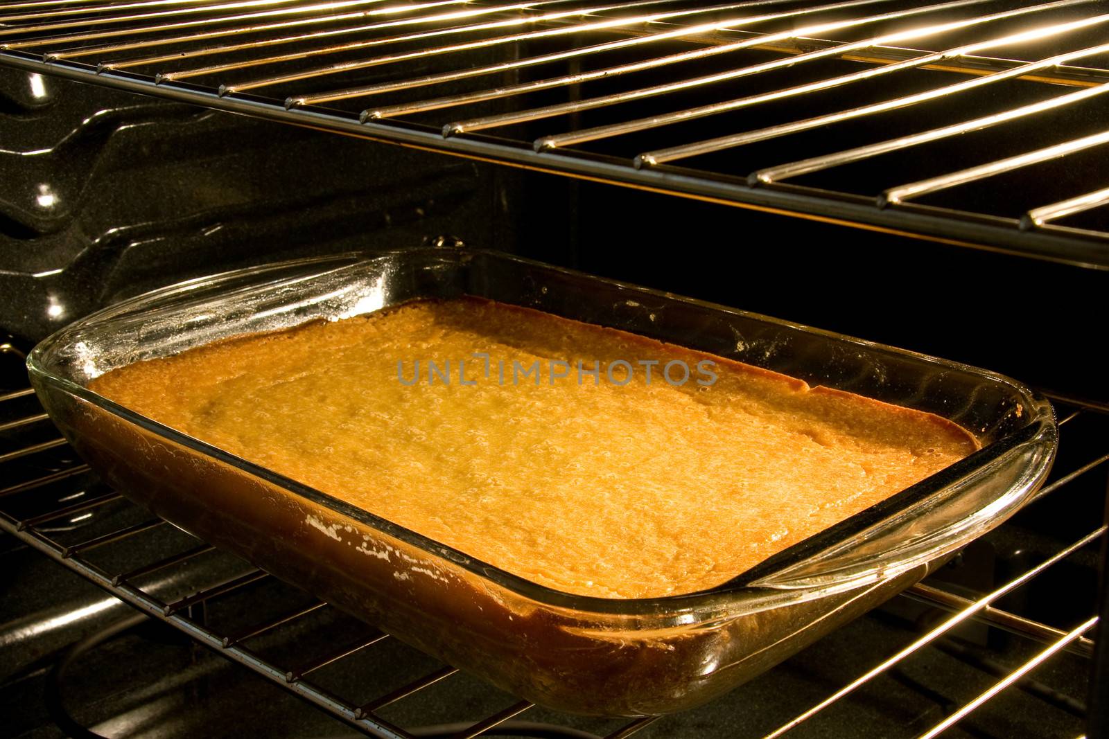 Closeup of corn cake baking in oven.