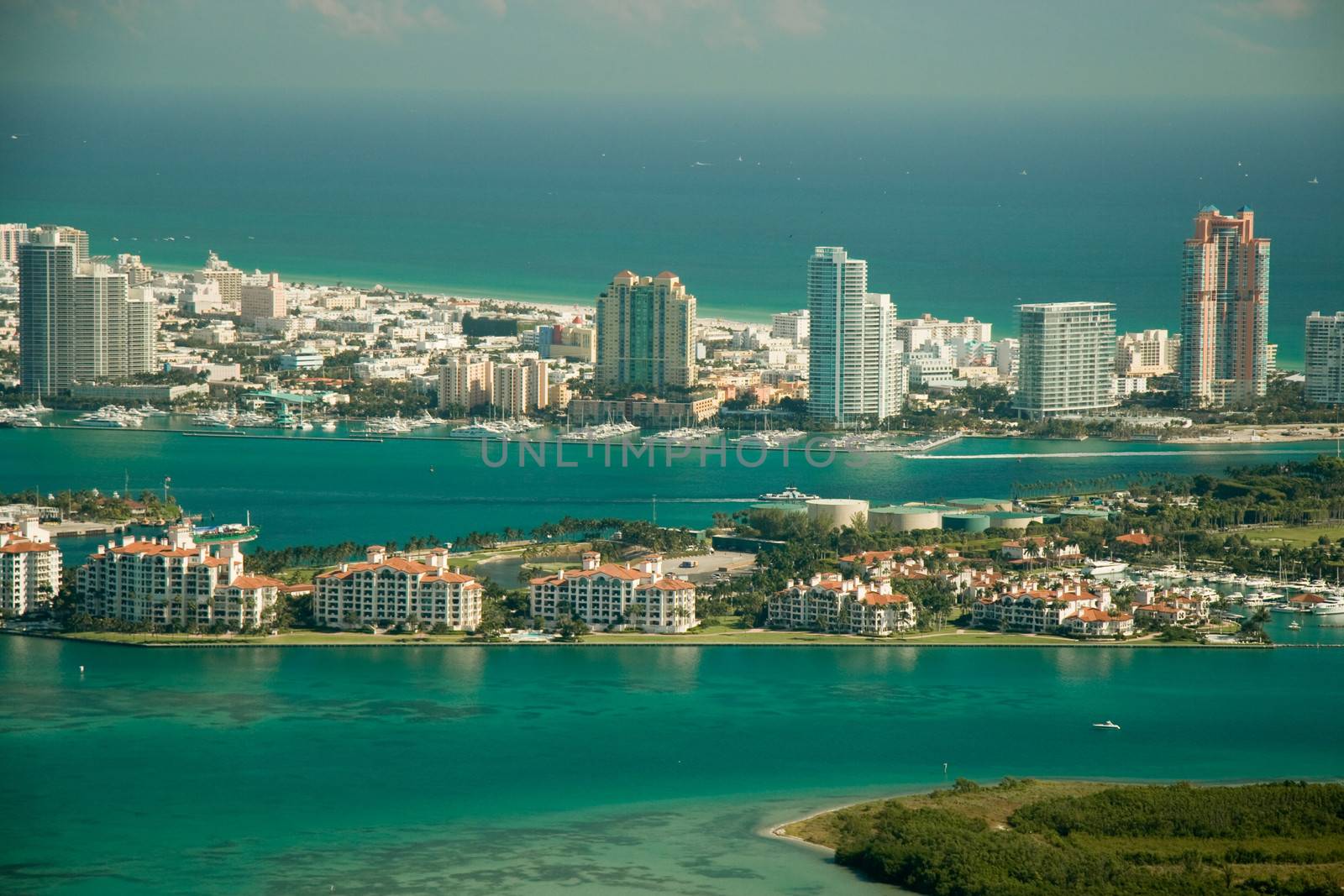 An aerial side view of the Fisher Island in Miami, Florida, USA.