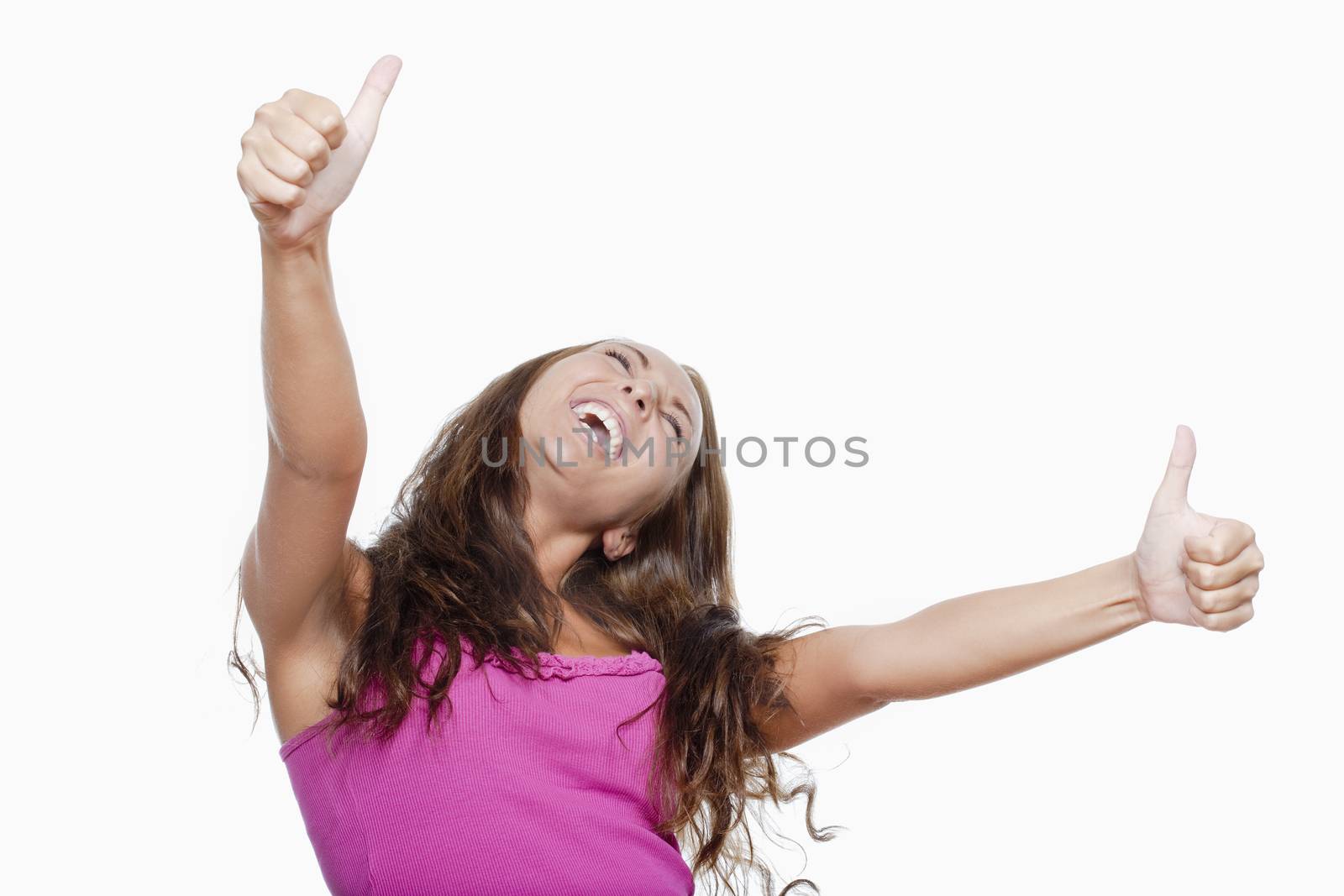 excited young girl showing both thumbs up screming - isolated on white