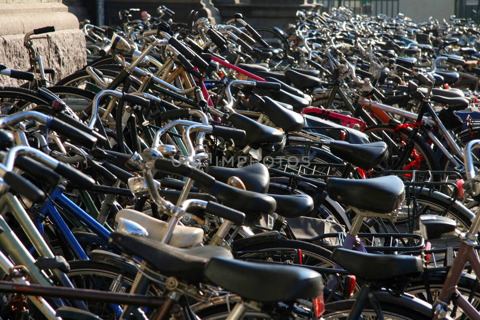 Hundreds of bikes on sidewalk by CelsoDiniz