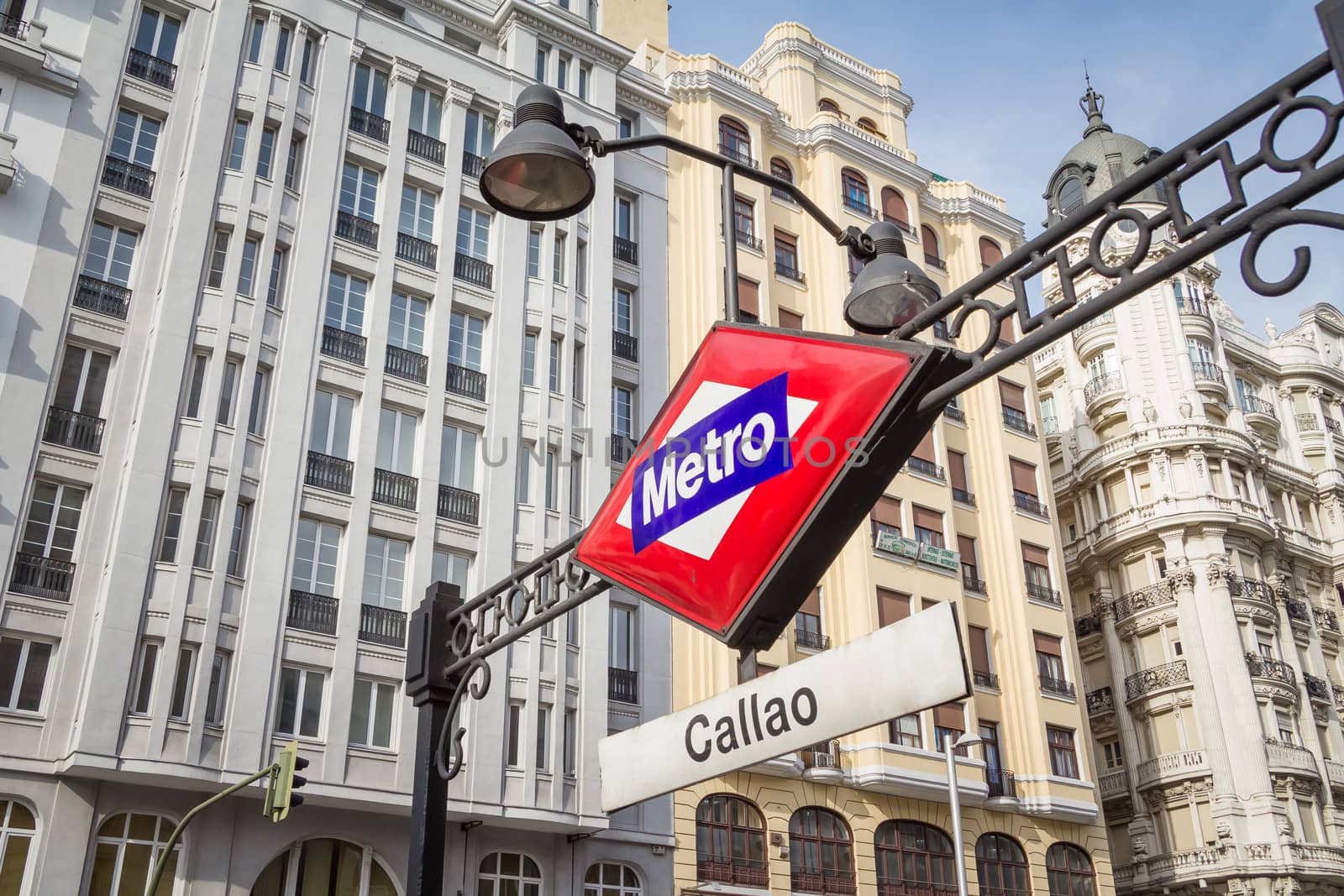 Callao metro sign over city background in Madrid, Spain