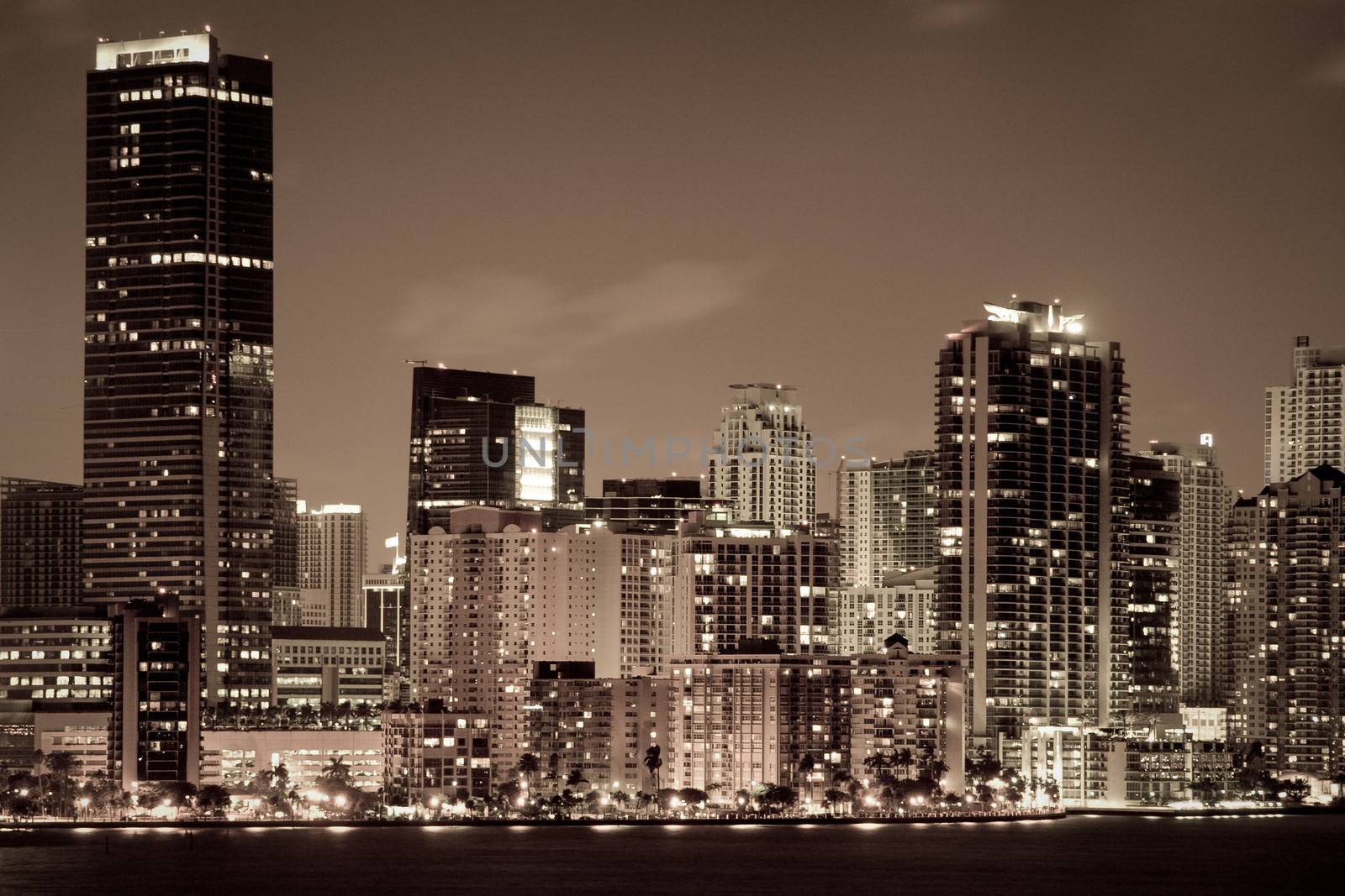 Skyscrapers lit up at dusk in a city, Miami, Miami-Dade County, Florida, USA