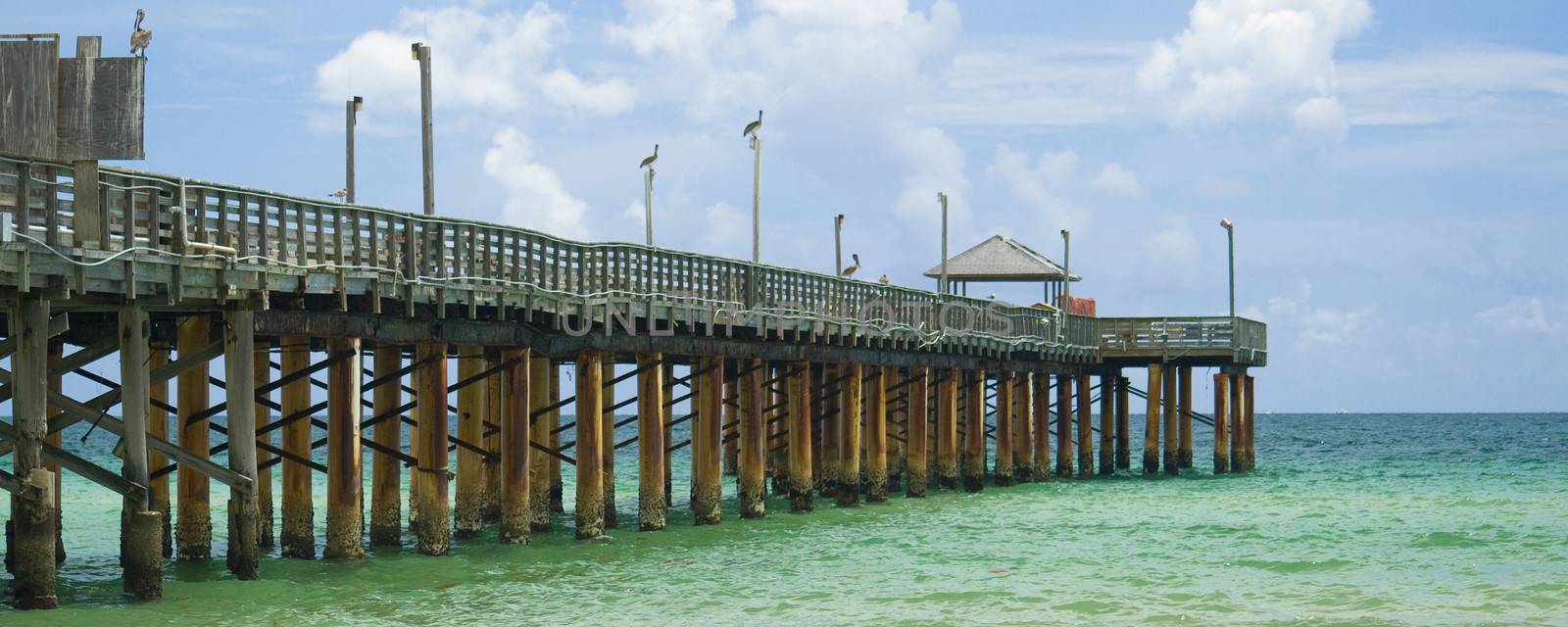 A beautiful wooden pier on a beach in Miami.