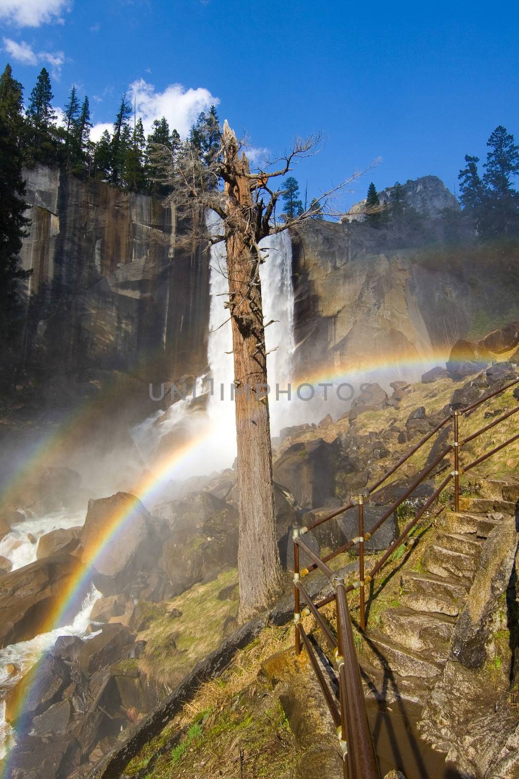 Rainbows on the Mist Trail, a one mile long slippery route through the spray of the Vernal Fall in Yosemite National Park.