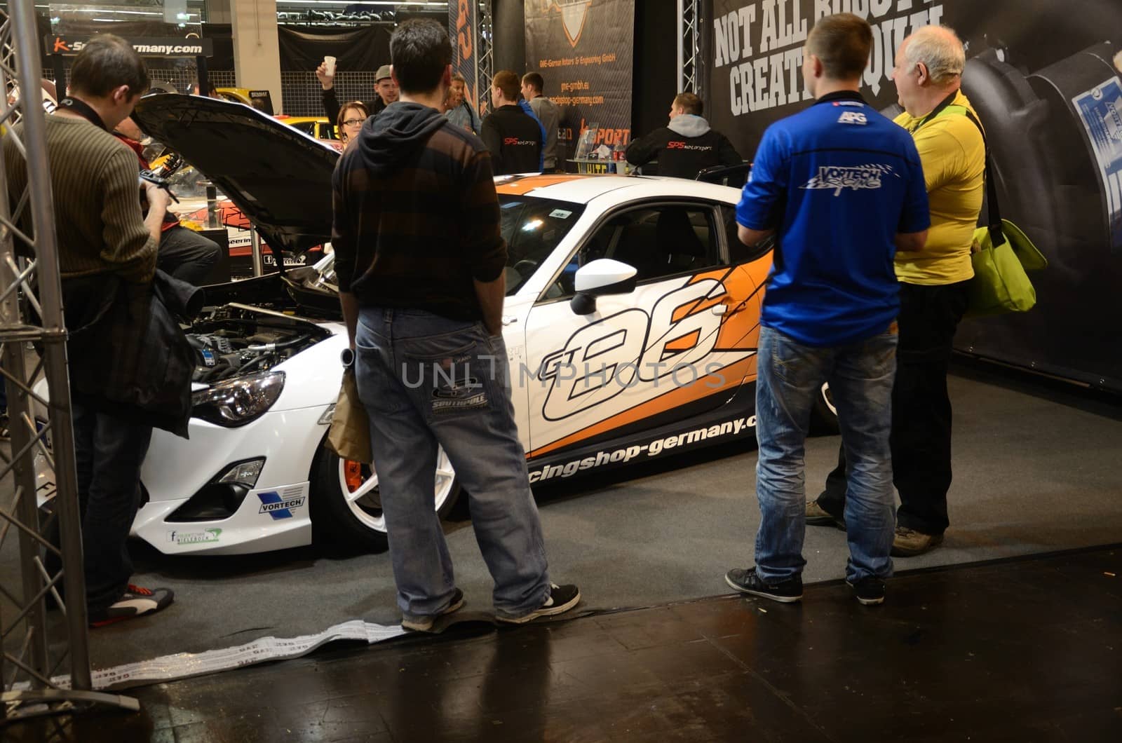 ESSEN, GERMANY - November 30: Visitors admire tunned cars during Essen Motor Show in Germany, on november 30, 2013.