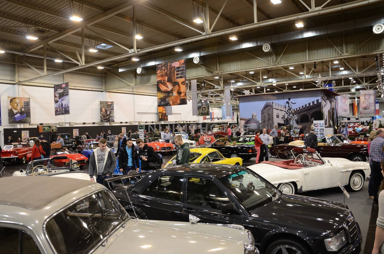 ESSEN, GERMANY - December 8: Visitors admire classic cars from Europe and USA during Essen Motor Show in Germany, on December 8, 2013.