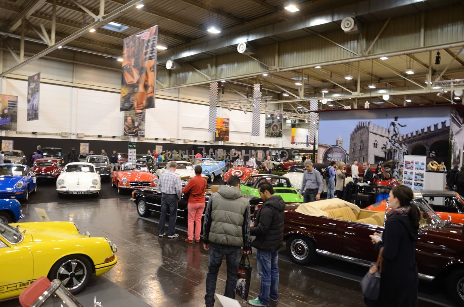 ESSEN, GERMANY - December 8: Visitors admire classic cars from Europe and USA during Essen Motor Show in Germany, on December 8, 2013.
