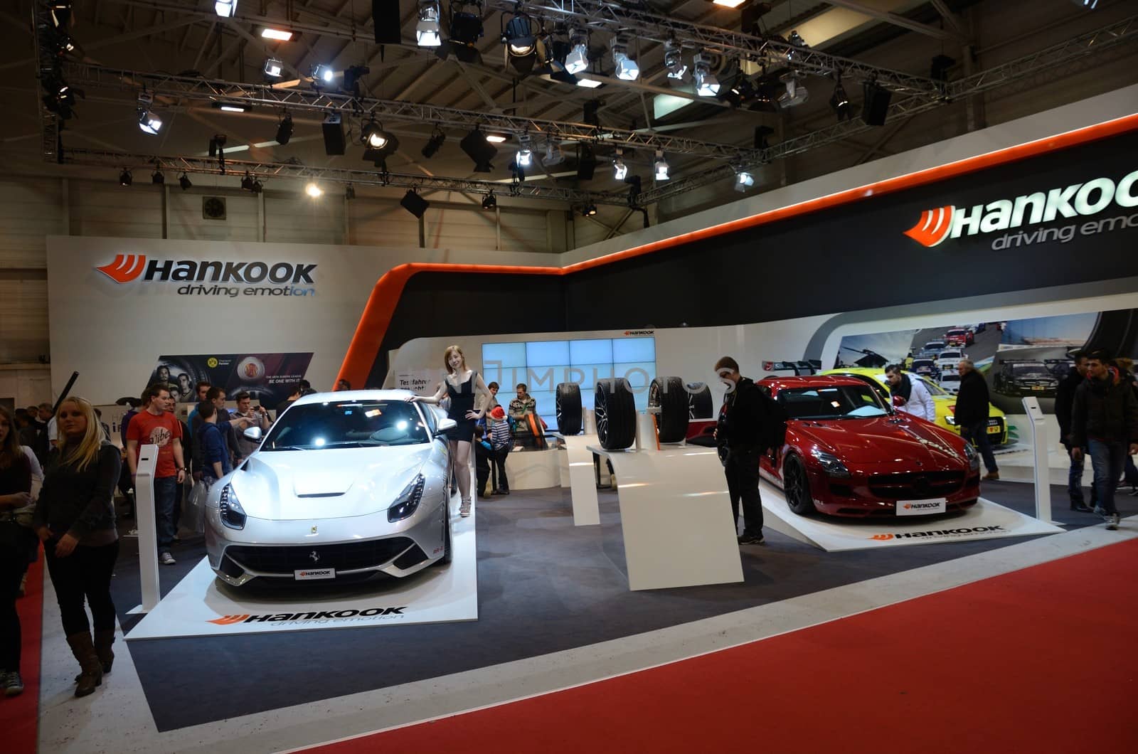 ESSEN, GERMANY - December 8: Modern Ferrari and Mercedes with Hankook tires during Essen Motor Show in Germany, on December 8, 2013.