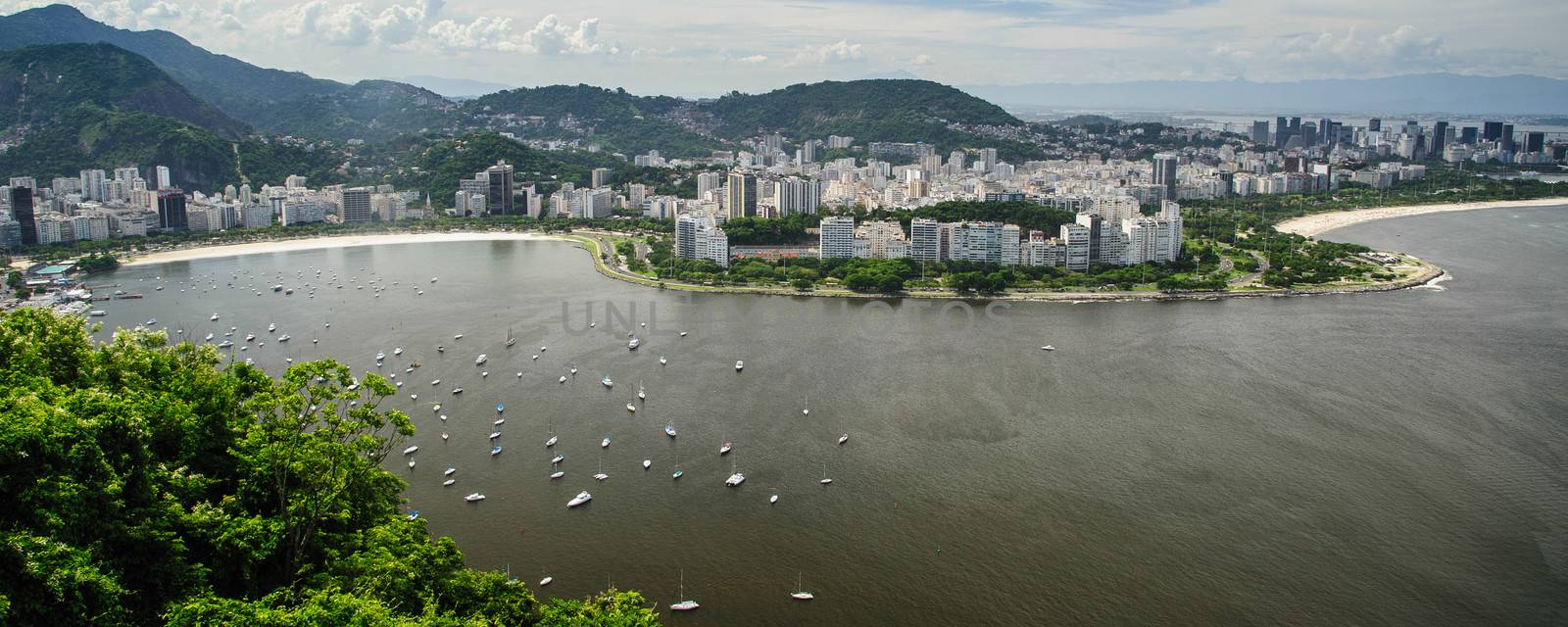 High angle view of Rio de Janeiro city coastline with boats in Guanbara bay, Brazil.