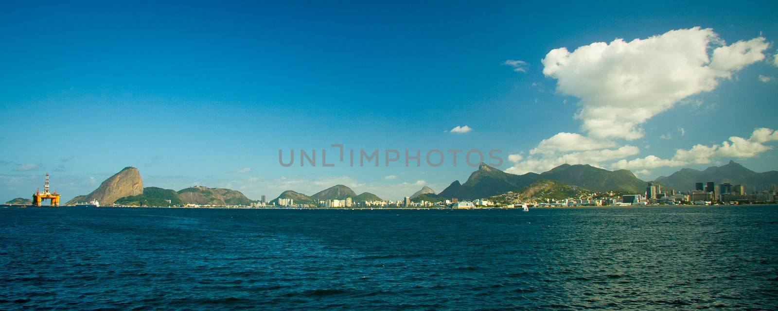 Rio de Janeiro landscape as seen from the Guanabara Bay showing the Sugar Loaf mountain on the left.