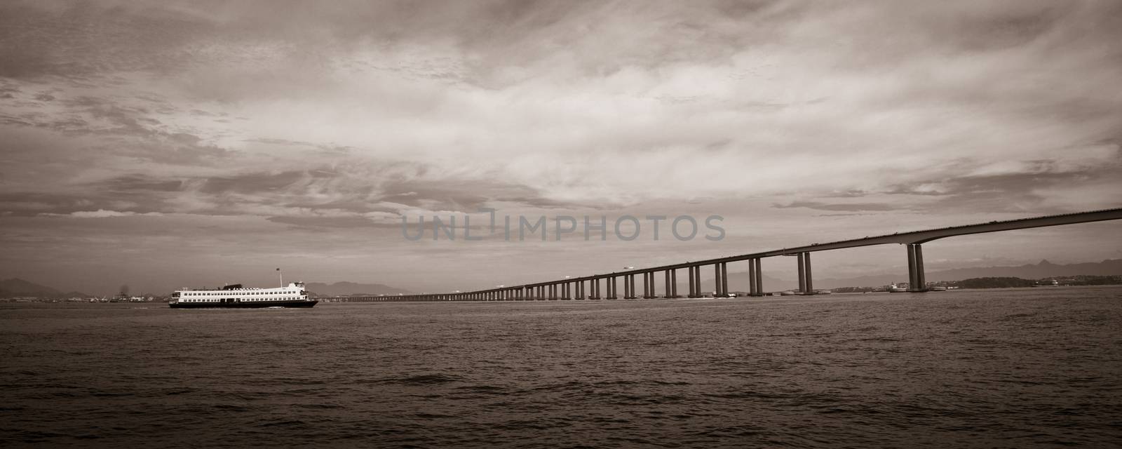 Panoramic black and white view of Rio de Janeiro to Niteroi bridge over Guanbara Bay, Brazil.