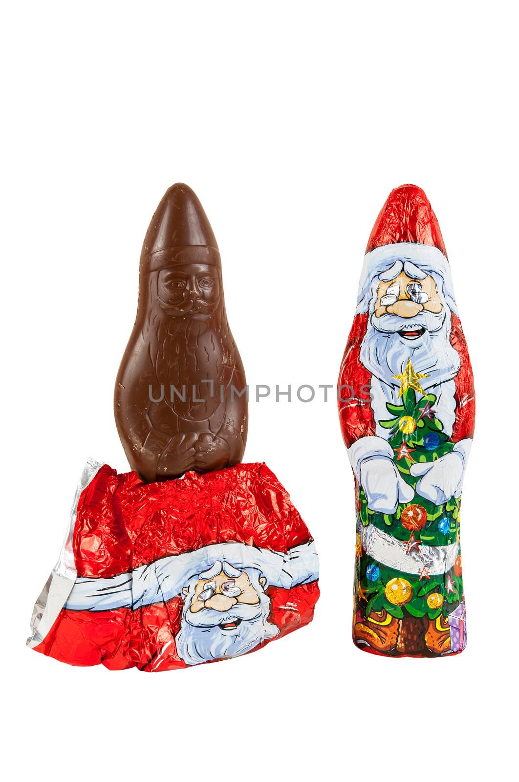 Wrapped chocolate figures of santa Claus isolated over white background with clipping path.