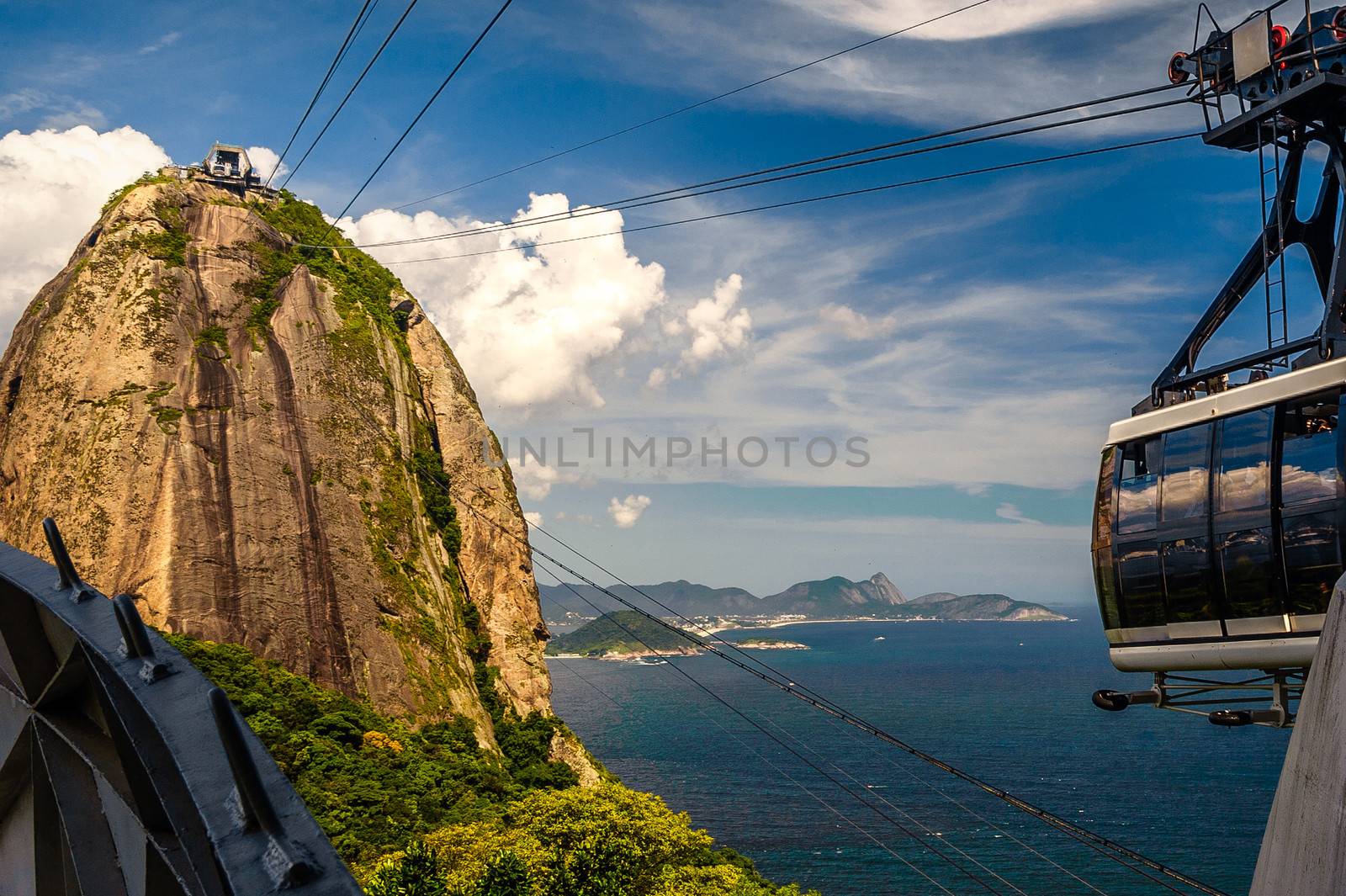 Overhead cable car approaching Sugarloaf Mountain, Guanabara Bay, Rio De Janeiro, Brazil