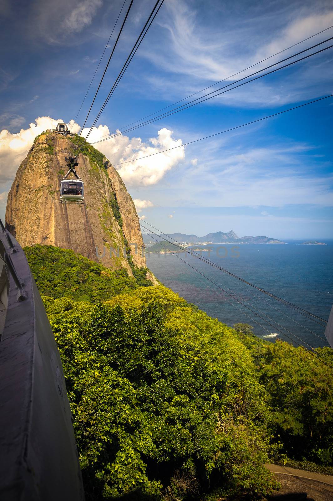 Overhead cable car approaching Sugarloaf Mountain, Guanabara Bay, Rio De Janeiro, Brazil