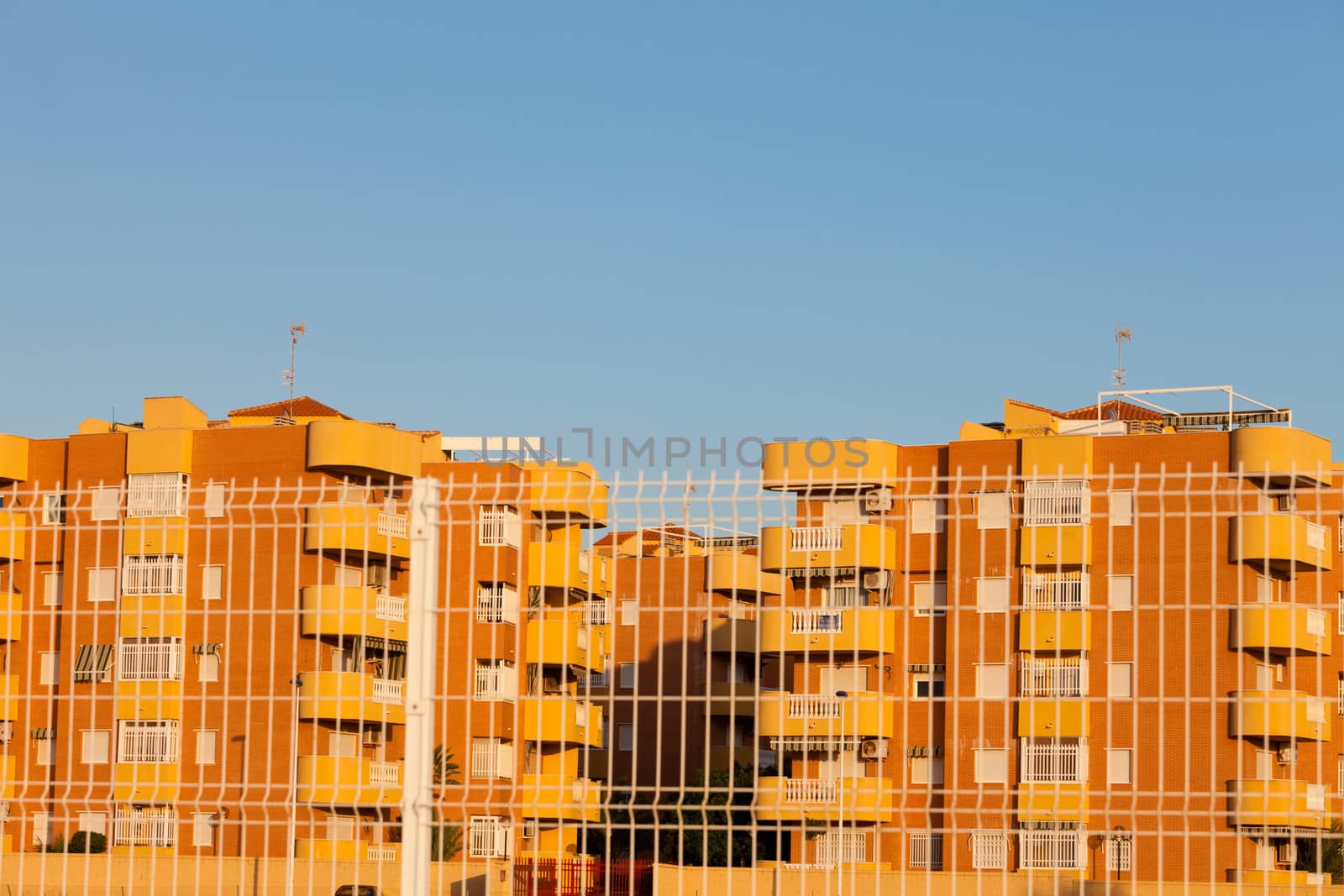 Spanish fenced-in modern architecture condominiums by PiLens