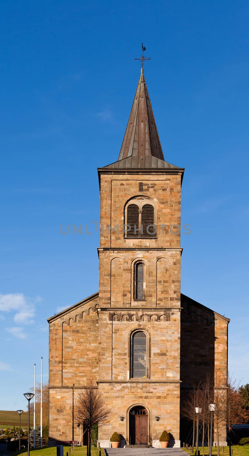 Old Germany rural village catholic stone church by PiLens