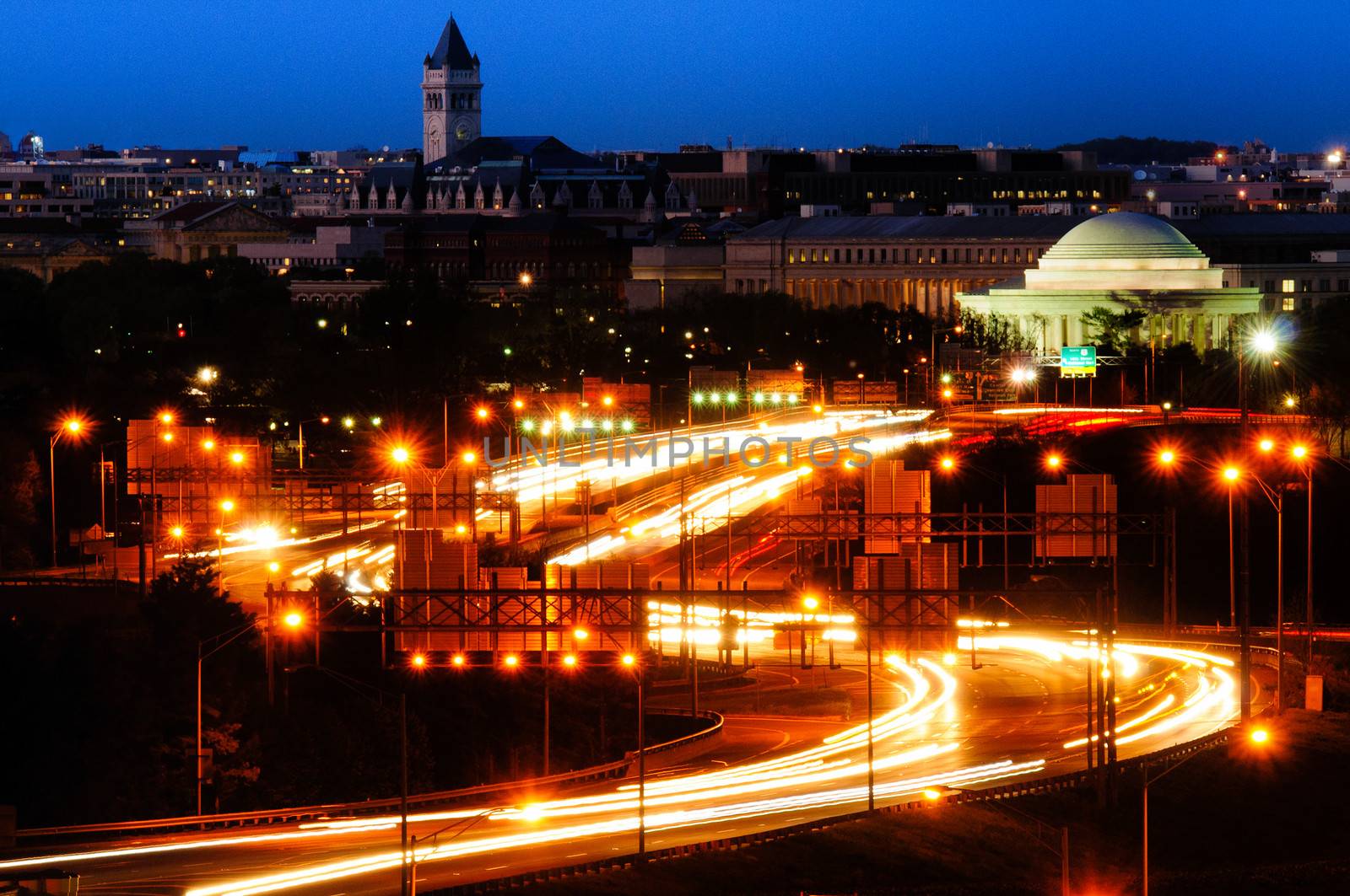 Traffic on a highway at night with a memorial in the background, Jefferson Memorial, Tidal Basin, Washington DC, USA