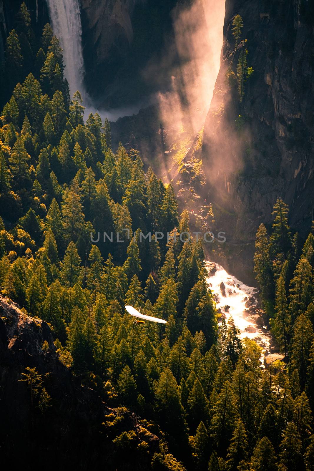 View from above of a valley and waterfall from Glacier Point in Yosemite National Park, California, USA.