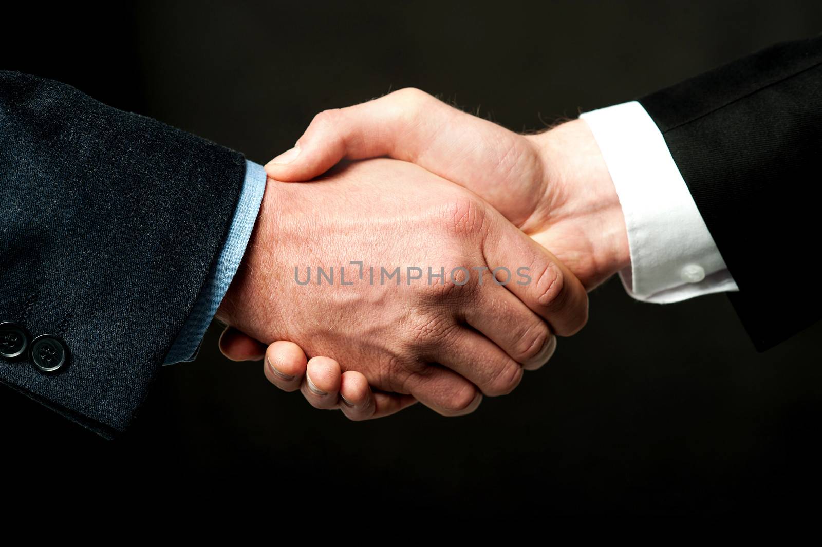 Business handshake after striking a deal