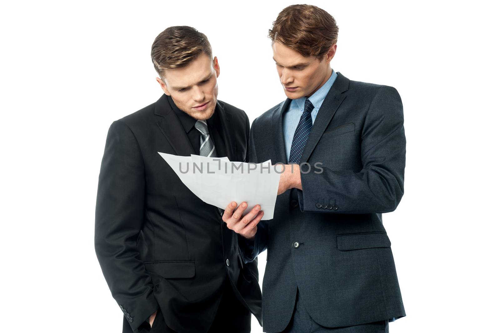 Serious business executives checking documents