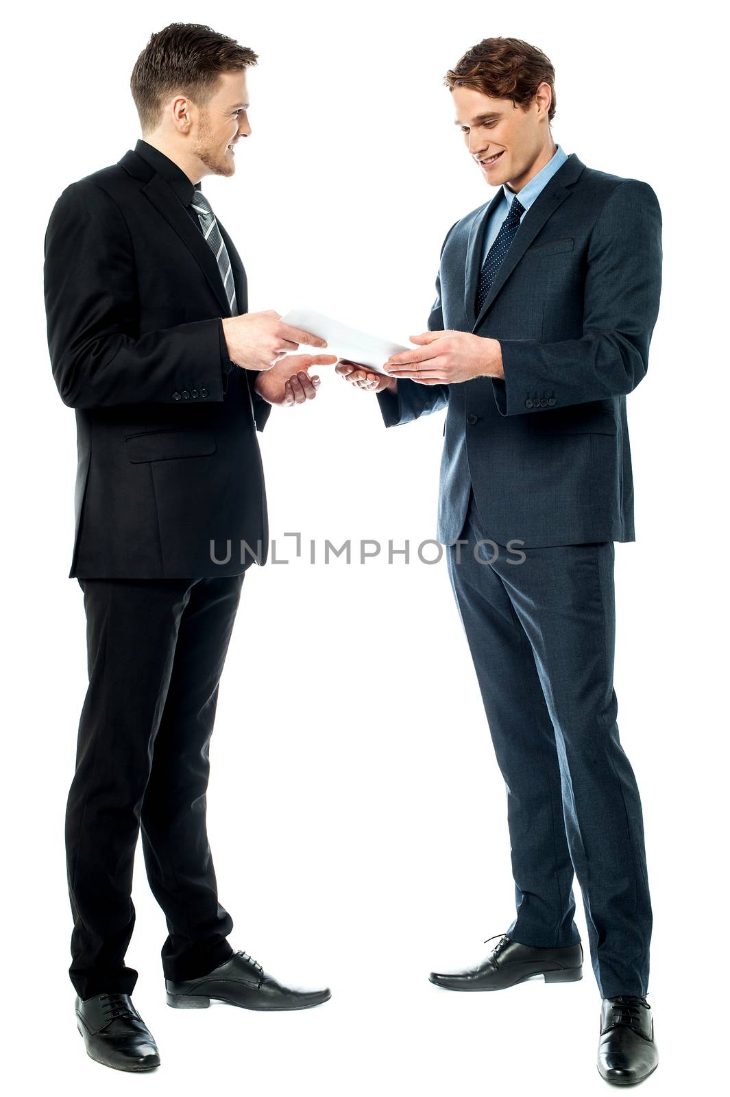 Two businessmen preparing a deal by stockyimages