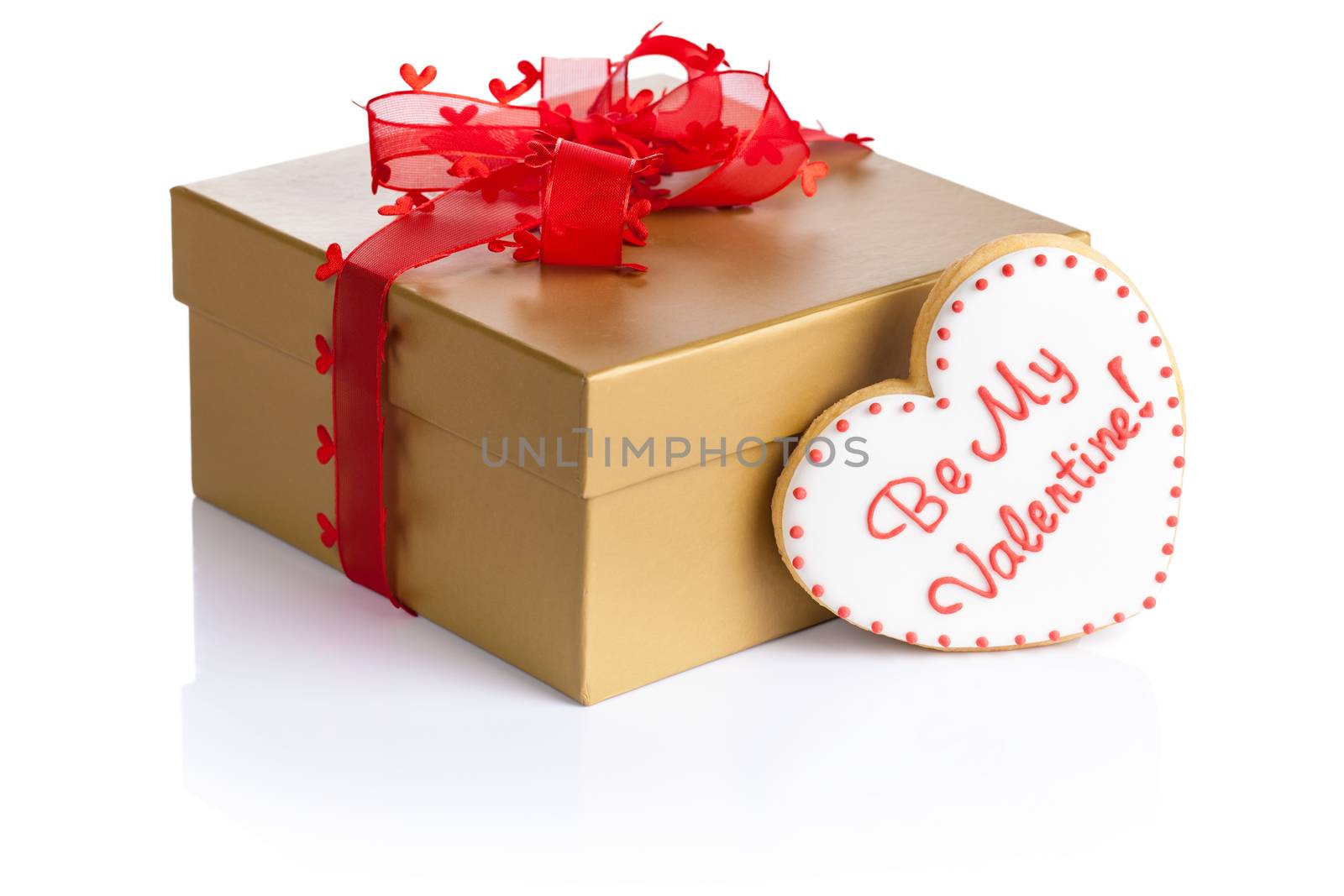 Gift box with cookie in shape of heart (Be my valentine) on white background. Composition for Valentines Day