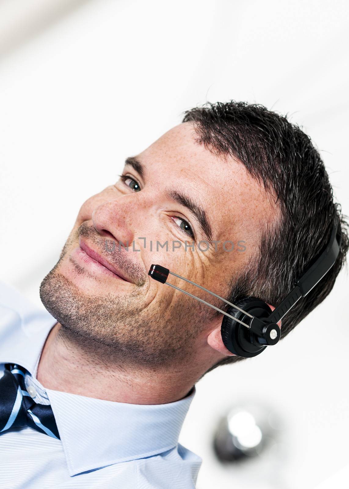 beautiful man is calling by headphone