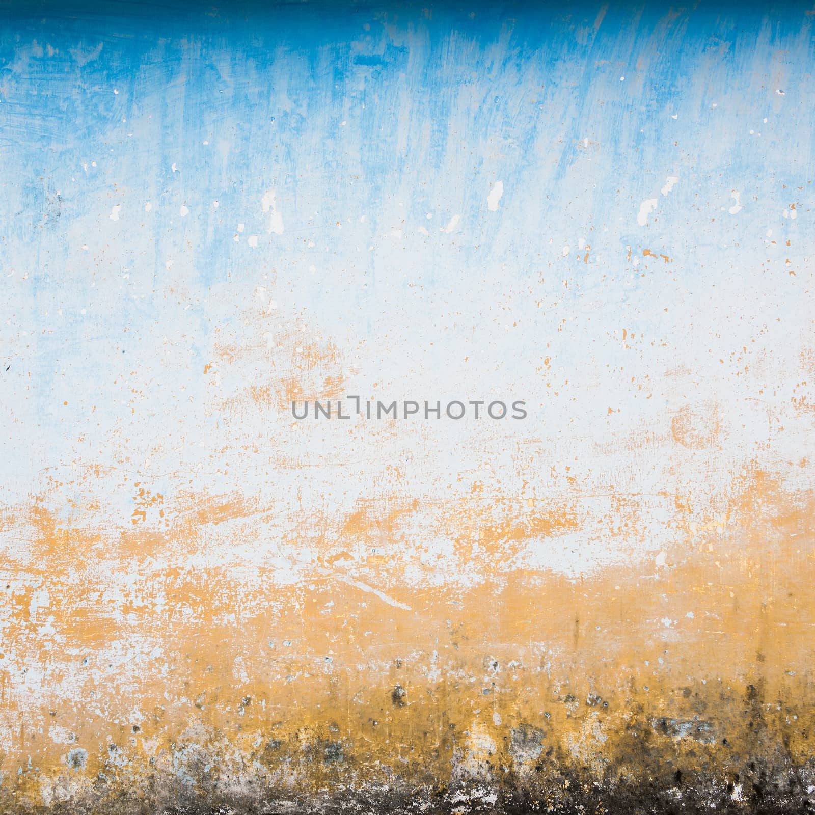 Dilapidated beige and blue wall texture, grungy background
