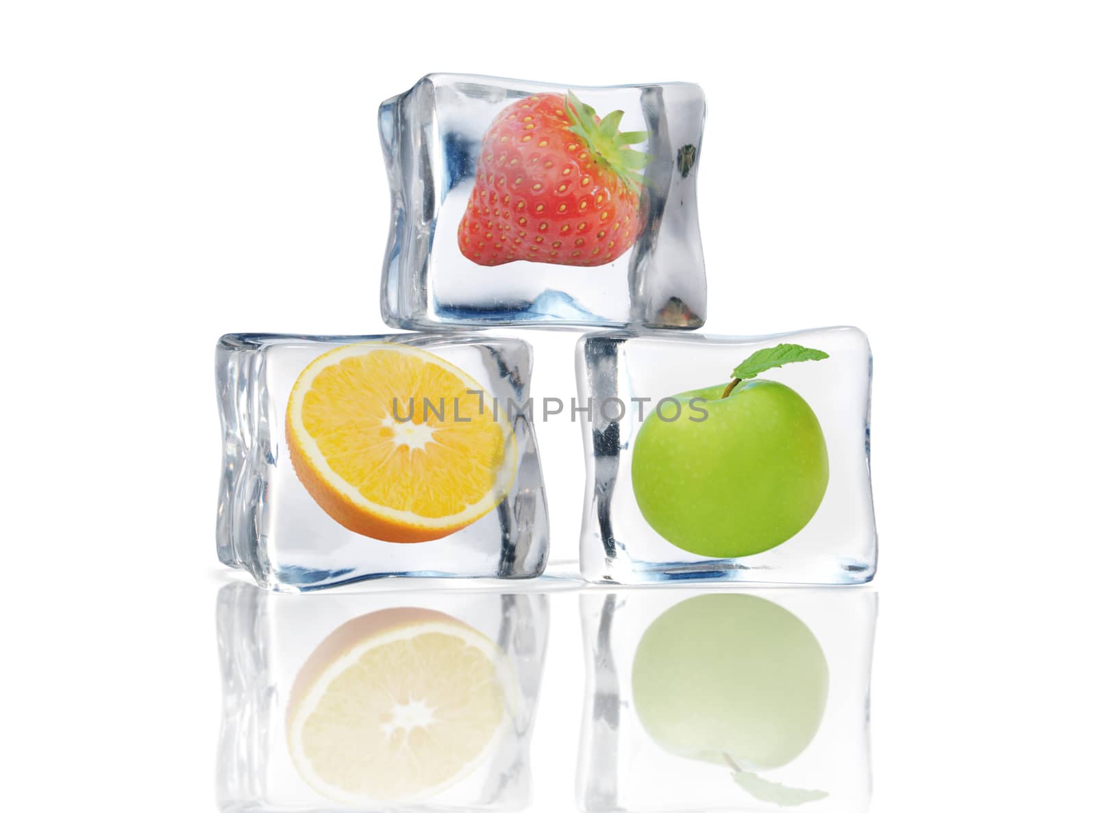 Fresh fruit frozen inside ice cubes over a white background 