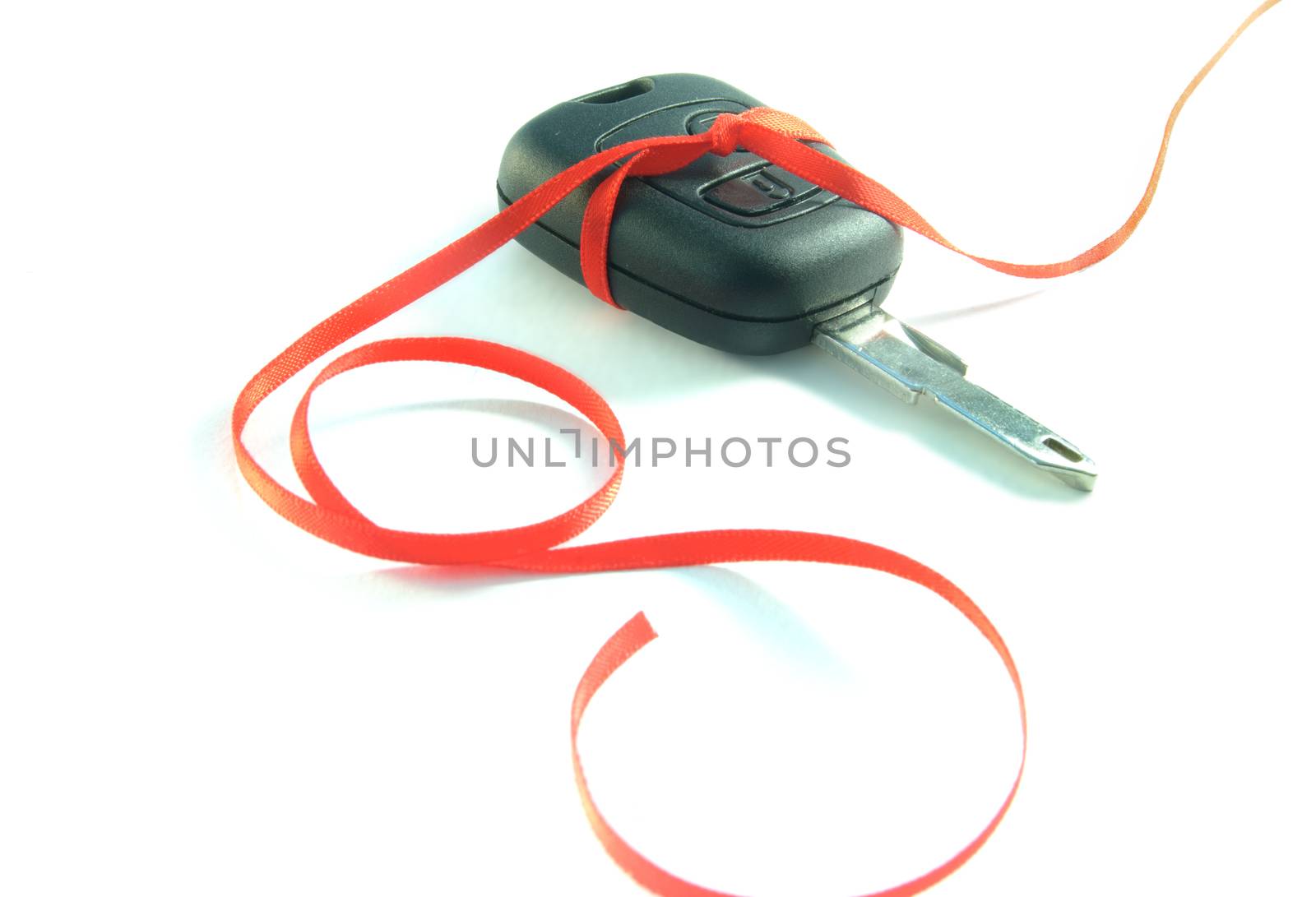 Gift ribbon tied around a set of car keys 