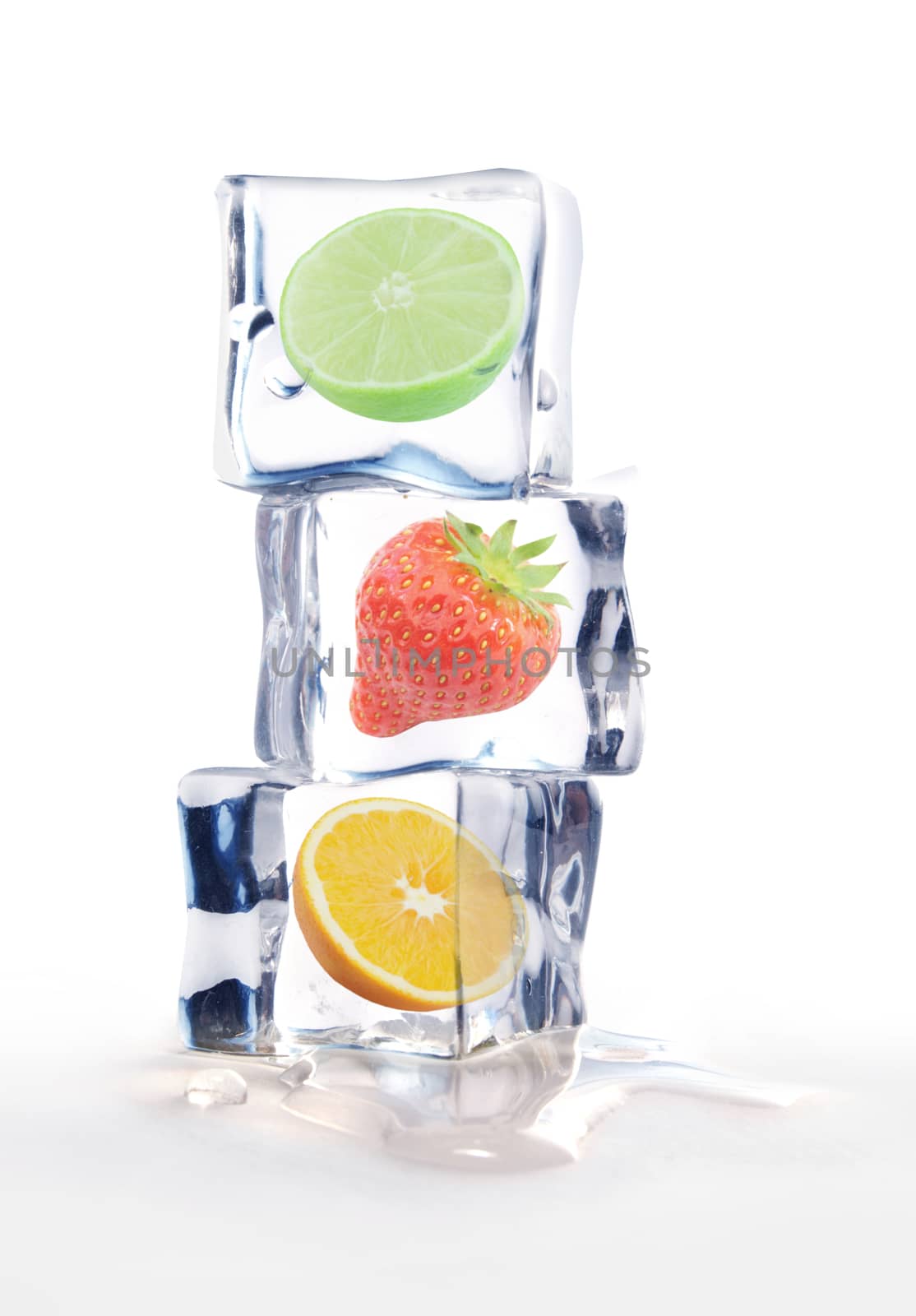 Fresh fruit frozen inside ice cubes over a white background 