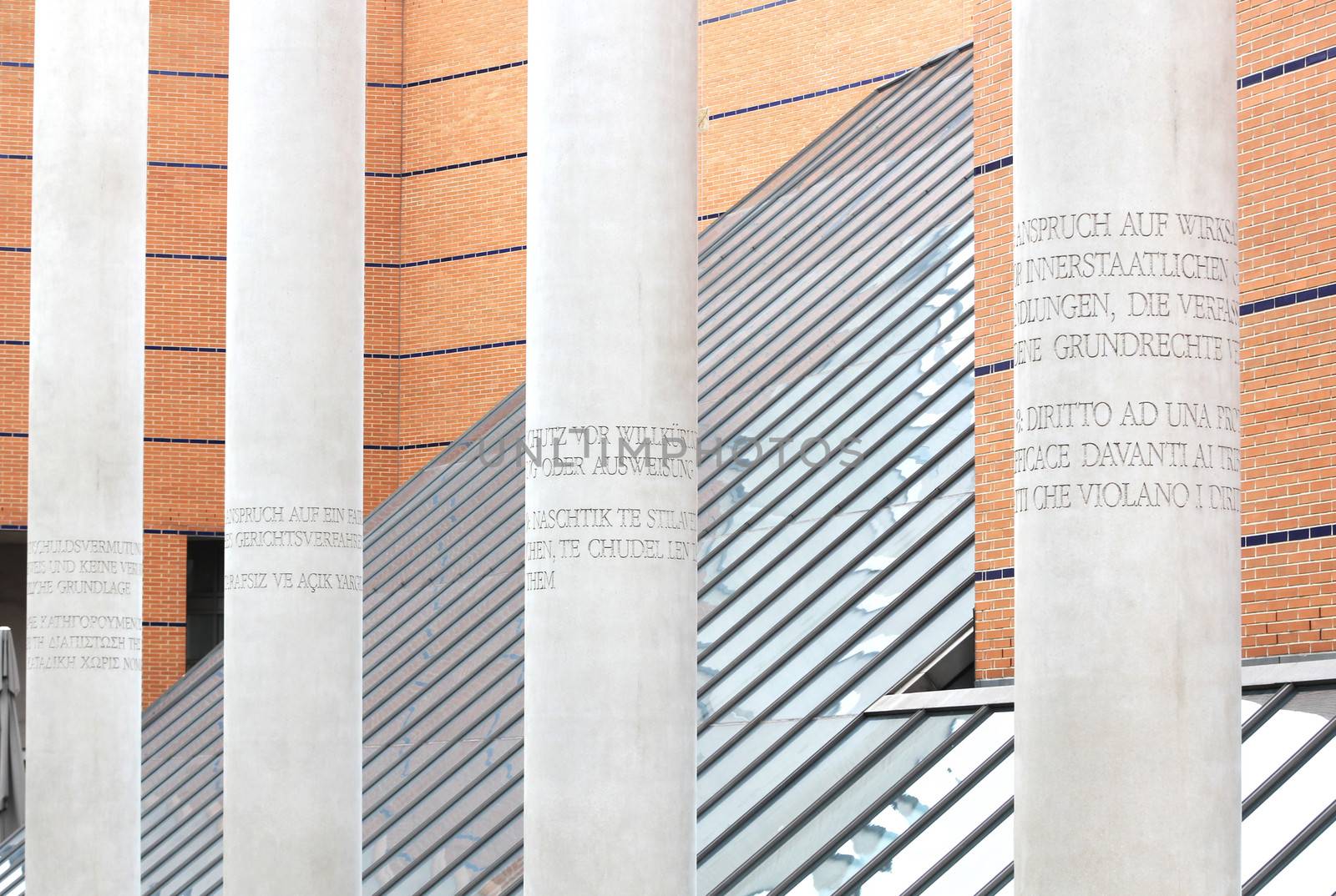 NUREMBERG, GERMANY - SEPTEMBER 21, 2013: Strasse der Menschenrechte, Way of Human Rights or Street of Human Rights with the Germanic National Museum or Germanisches Nationalmuseum in the background. Concrete pillars engraved with articles of the 1948 Universal Declaration of Human Rights created by Dani karavan in 1993. Photo taken on September 21, 2013 in Nuremberg, Franconia, Bavaria, Germany.