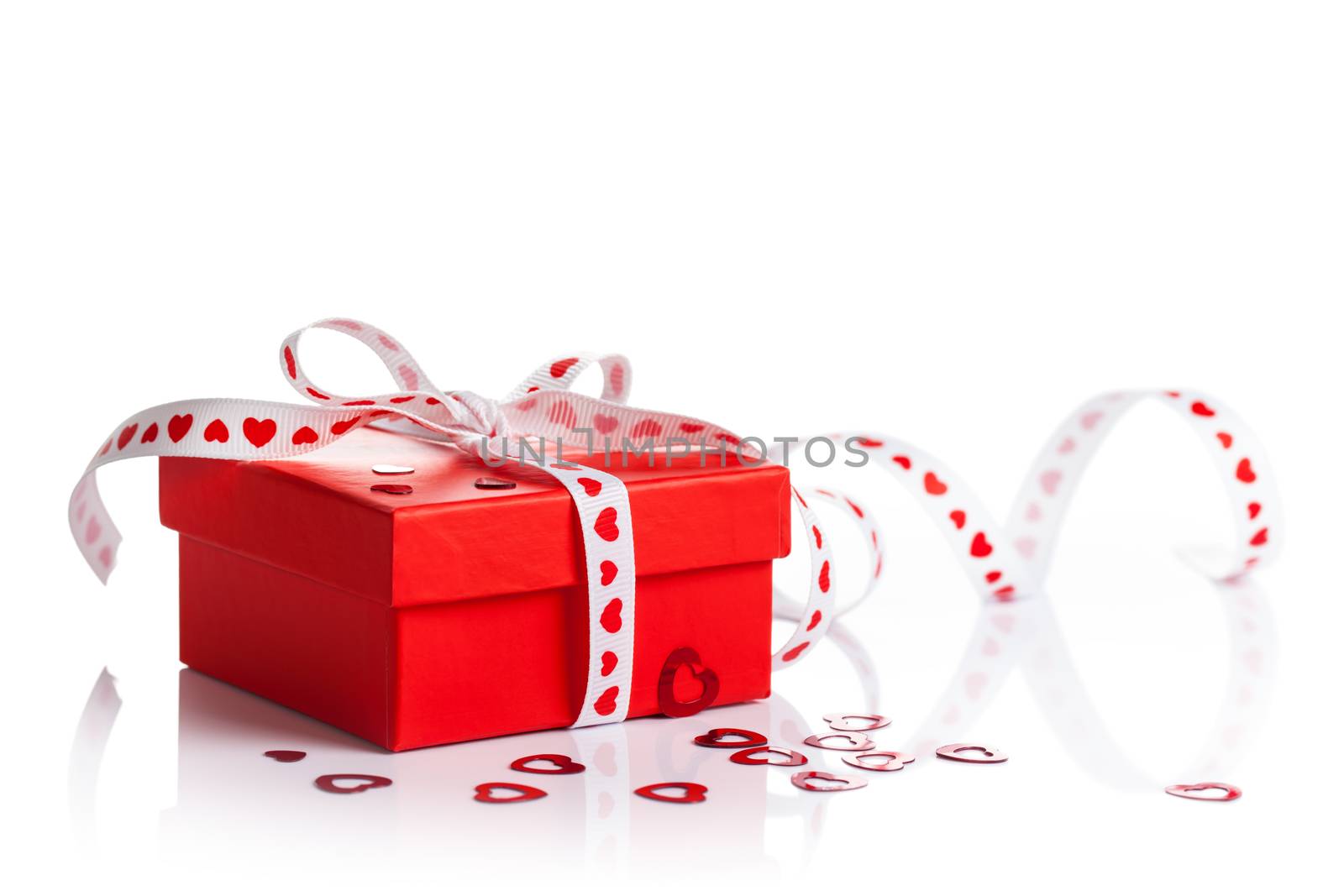 Gift box with ribbon on white background. Valentines Day composition